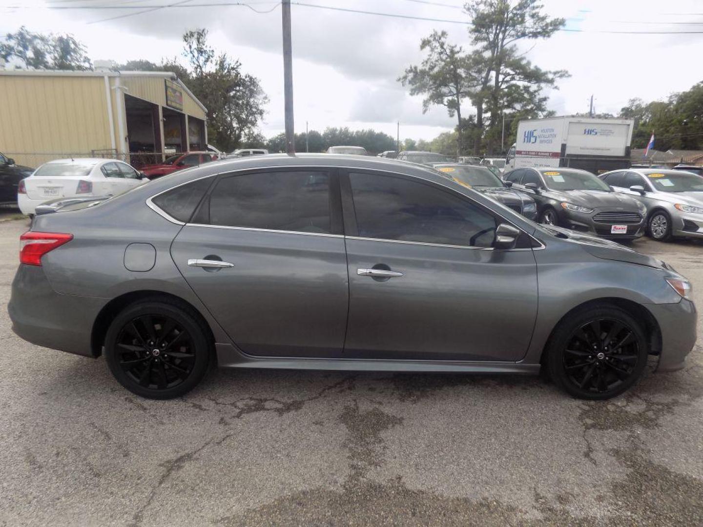 2018 GRAY NISSAN SENTRA S (3N1AB7AP7JY) with an 1.8L engine, Continuously Variable transmission, located at 830 E. Canino Rd., Houston, TX, 77037, (281) 405-0440, 38.358219, -81.729942 - PAGOS COMODOS, ENGANCHES COMODOS. FINANCIAMIENTO RAPIDO Y FACIL. BUEN CREDITO, MAL CREDITO, COMPRADOR POR PRIMERA VES O NO LICENCIA, CANINO AUTO SALES TE PUEDE AYUDAR! LLAMA/TEXTO O VISITANOS HOY MISMO (281) 405-0440 ESTAMOS LOCALIZADOS EN 830 E. CANINO RD. (ESQUINA CON AIRLINE) HOUSTON, TEXAS - Photo#1