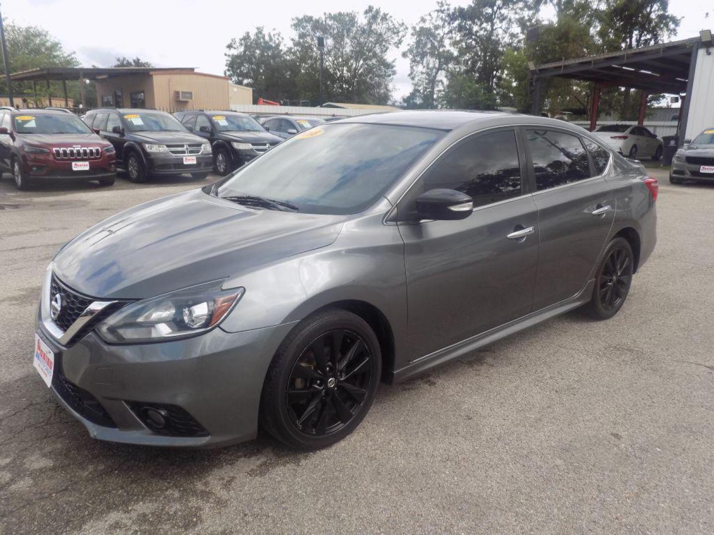 2018 GRAY NISSAN SENTRA S (3N1AB7AP7JY) with an 1.8L engine, Continuously Variable transmission, located at 830 E. Canino Rd., Houston, TX, 77037, (281) 405-0440, 38.358219, -81.729942 - PAGOS COMODOS, ENGANCHES COMODOS. FINANCIAMIENTO RAPIDO Y FACIL. BUEN CREDITO, MAL CREDITO, COMPRADOR POR PRIMERA VES O NO LICENCIA, CANINO AUTO SALES TE PUEDE AYUDAR! LLAMA/TEXTO O VISITANOS HOY MISMO (281) 405-0440 ESTAMOS LOCALIZADOS EN 830 E. CANINO RD. (ESQUINA CON AIRLINE) HOUSTON, TEXAS - Photo#5