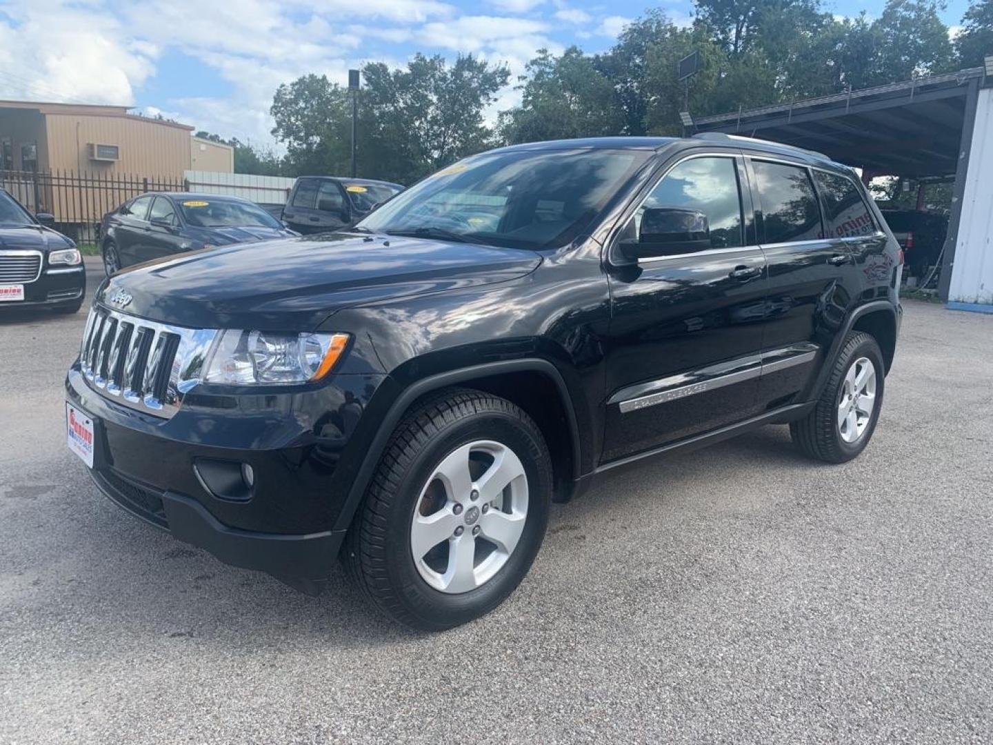 2012 BLACK JEEP GRAND CHEROKEE LAREDO (1C4RJFAG8CC) with an 3.6L engine, Automatic transmission, located at 830 E. Canino Rd., Houston, TX, 77037, (281) 405-0440, 38.358219, -81.729942 - Photo#1