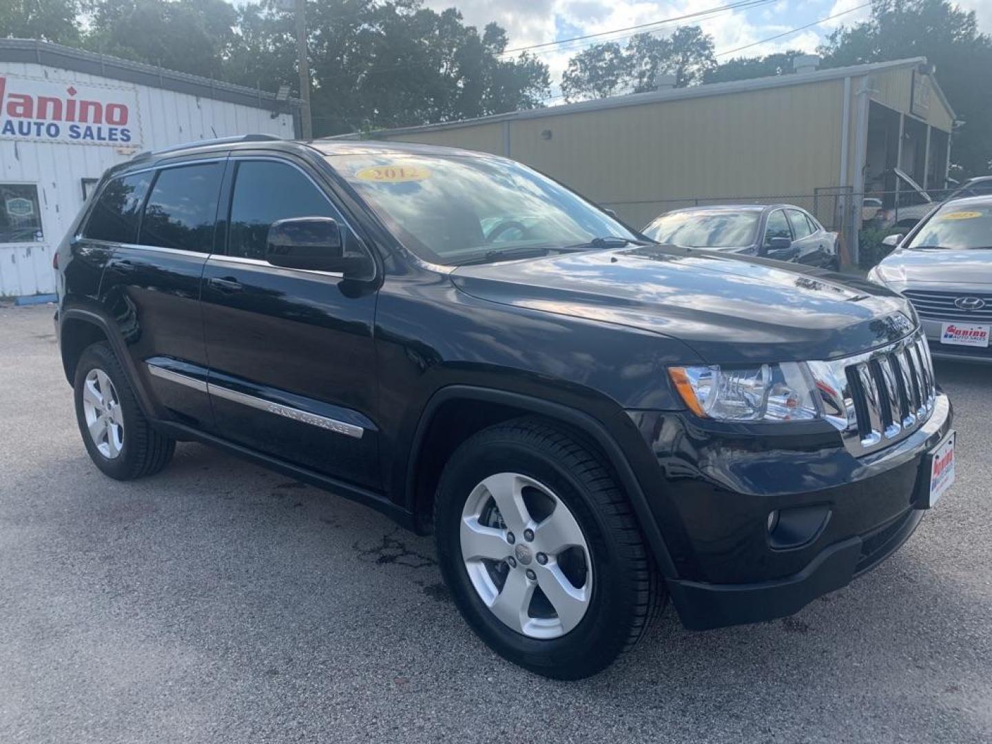 2012 BLACK JEEP GRAND CHEROKEE LAREDO (1C4RJFAG8CC) with an 3.6L engine, Automatic transmission, located at 830 E. Canino Rd., Houston, TX, 77037, (281) 405-0440, 38.358219, -81.729942 - Photo#5