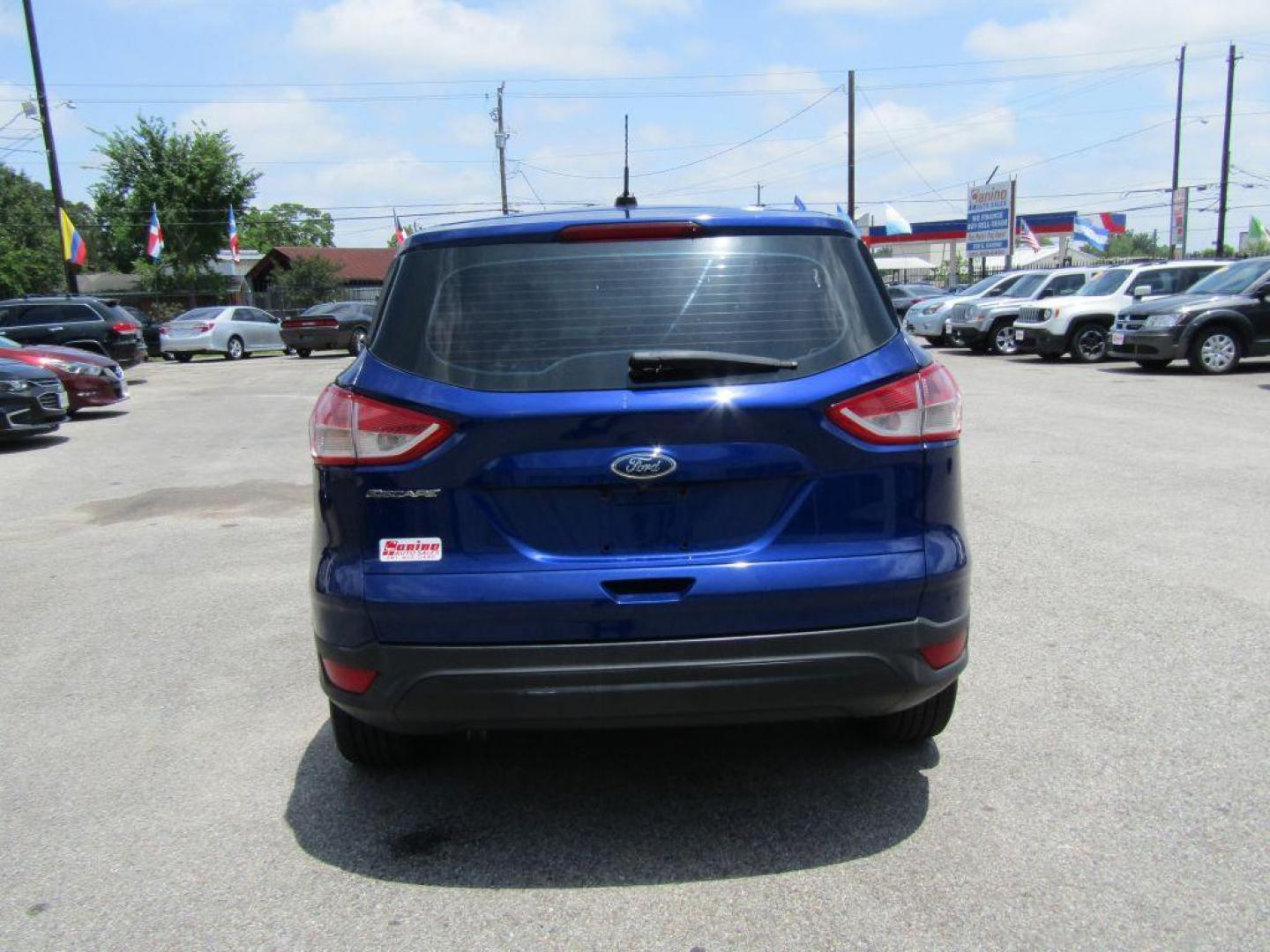 2015 BLUE FORD ESCAPE S (1FMCU0F71FU) with an 2.5L engine, Automatic transmission, located at 830 E. Canino Rd., Houston, TX, 77037, (281) 405-0440, 38.358219, -81.729942 - $1,500 DOWN + TT and L IN HOUSE FINANCING AVAILABLE FINANCIAMIENTO EN CASA DISPONIBLE CALL OR COME IN TODAY 281 405 0440 CANINO AUTO SALES, LLC - Photo#3