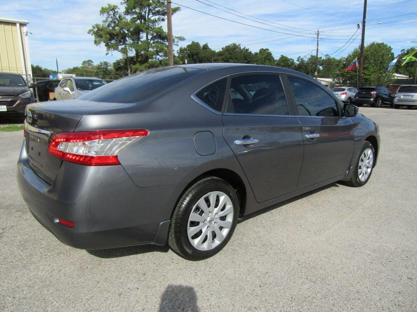 2015 GRAY NISSAN SENTRA S (3N1AB7AP5FY) with an 1.8L engine, Continuously Variable transmission, located at 830 E. Canino Rd., Houston, TX, 77037, (281) 405-0440, 38.358219, -81.729942 - Photo#2