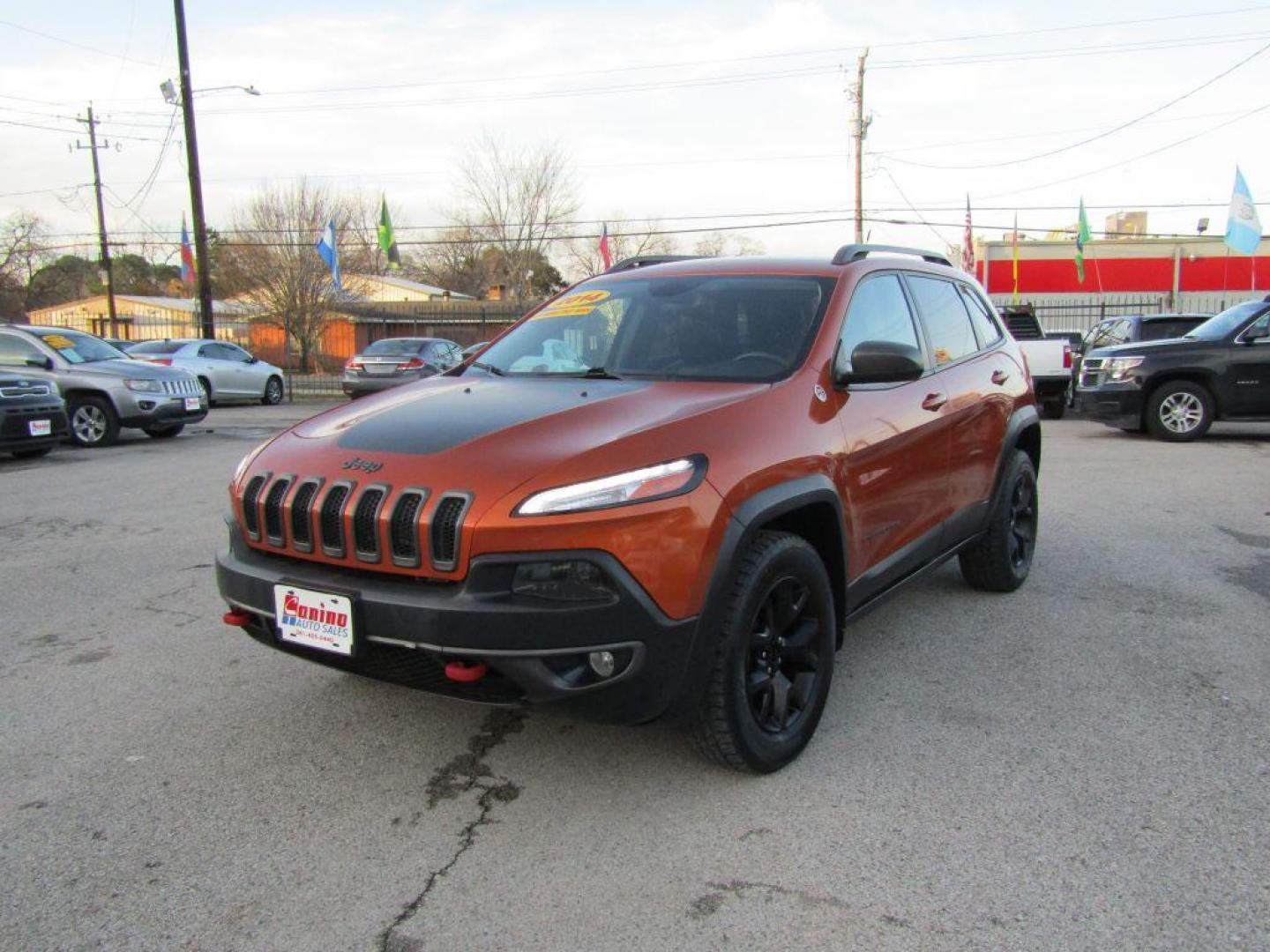 2014 ORANGE JEEP CHEROKEE TRAILHAWK (1C4PJMBS6EW) with an 3.2L engine, Automatic transmission, located at 830 E. Canino Rd., Houston, TX, 77037, (281) 405-0440, 38.358219, -81.729942 - Photo#1