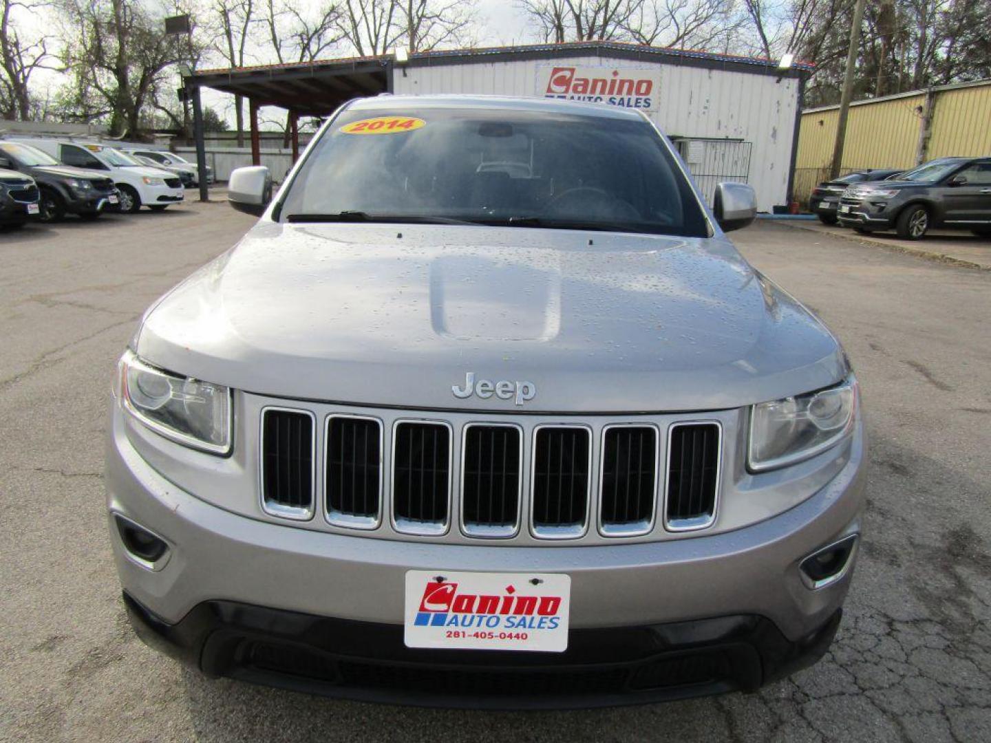 2014 SILVER JEEP GRAND CHEROKEE LAREDO (1C4RJEAG7EC) with an 3.6L engine, Automatic transmission, located at 830 E. Canino Rd., Houston, TX, 77037, (281) 405-0440, 38.358219, -81.729942 - Photo#0