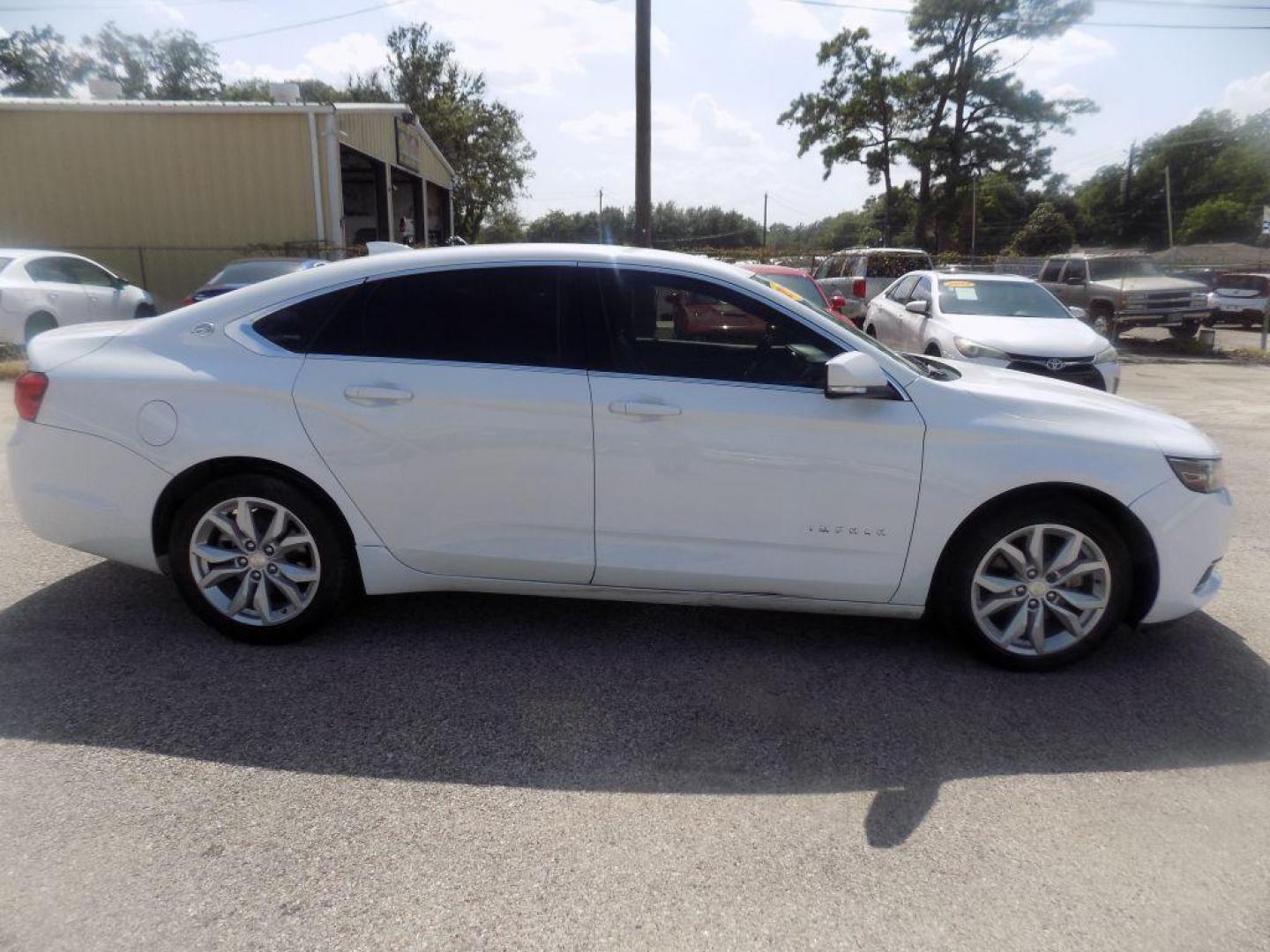 2017 WHITE CHEVROLET IMPALA LT (1G1105S39HU) with an 3.6L engine, Automatic transmission, located at 830 E. Canino Rd., Houston, TX, 77037, (281) 405-0440, 38.358219, -81.729942 - Photo#1