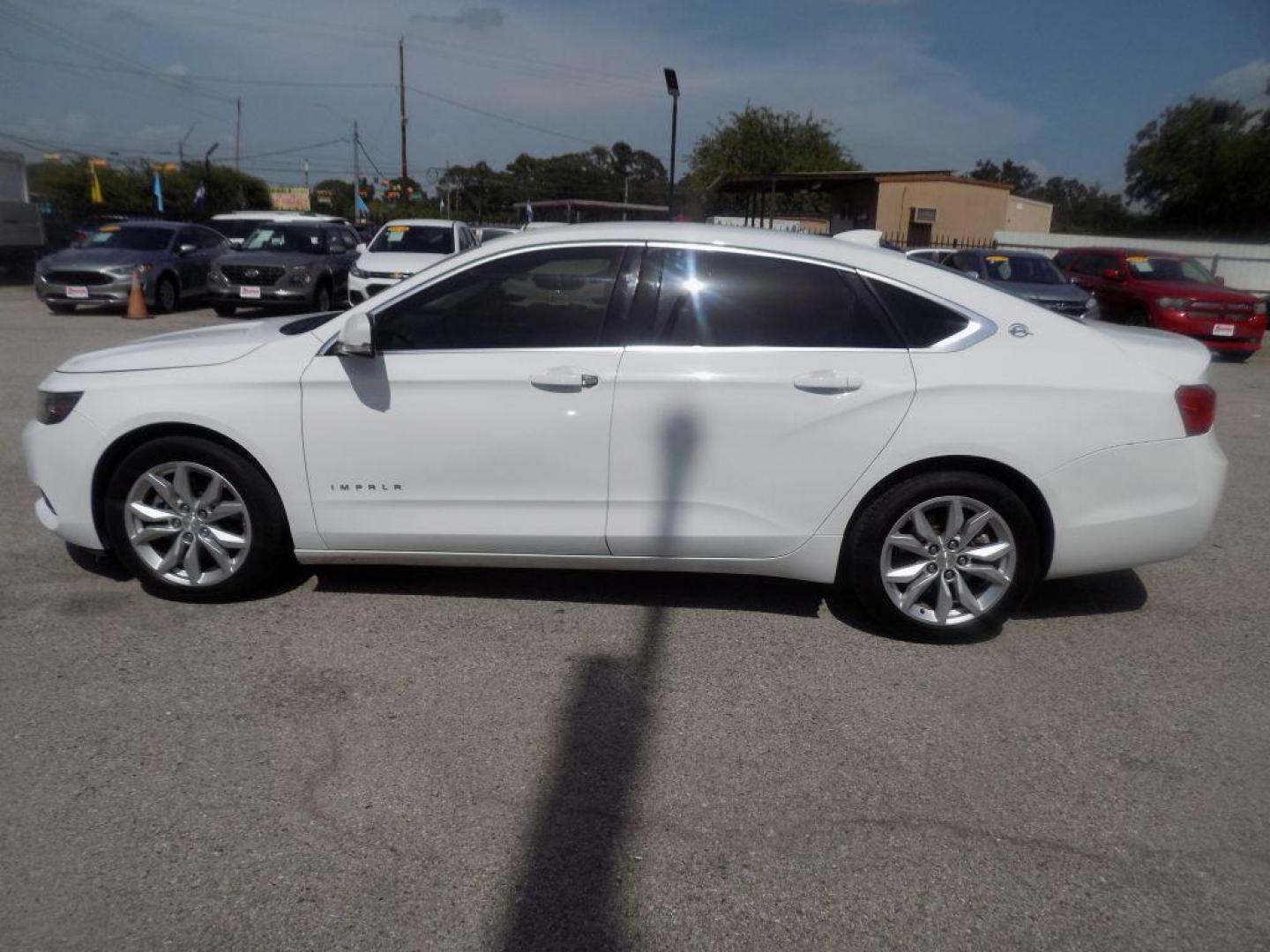 2017 WHITE CHEVROLET IMPALA LT (1G1105S39HU) with an 3.6L engine, Automatic transmission, located at 830 E. Canino Rd., Houston, TX, 77037, (281) 405-0440, 38.358219, -81.729942 - Photo#3