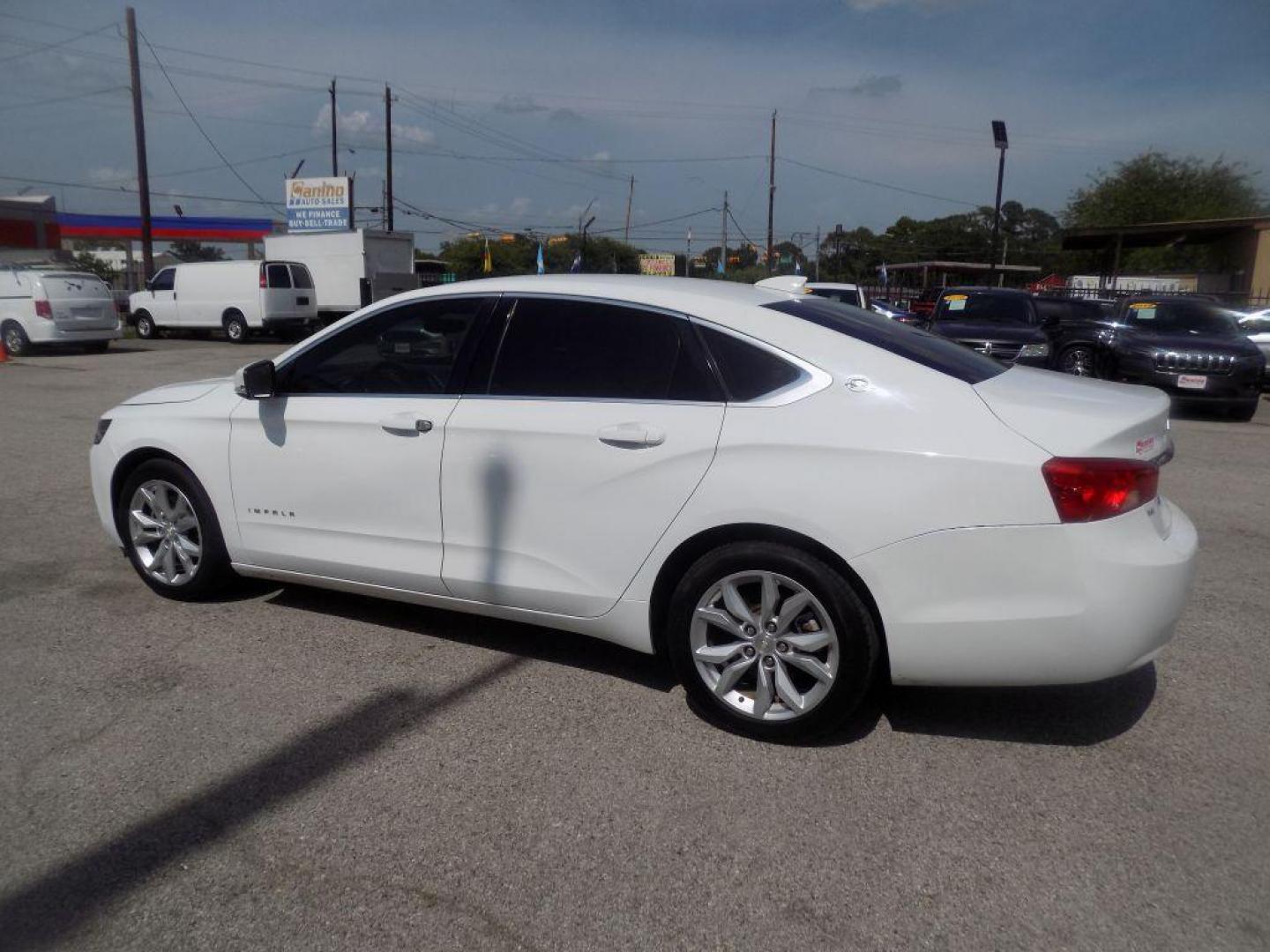 2017 WHITE CHEVROLET IMPALA LT (1G1105S39HU) with an 3.6L engine, Automatic transmission, located at 830 E. Canino Rd., Houston, TX, 77037, (281) 405-0440, 38.358219, -81.729942 - Photo#4