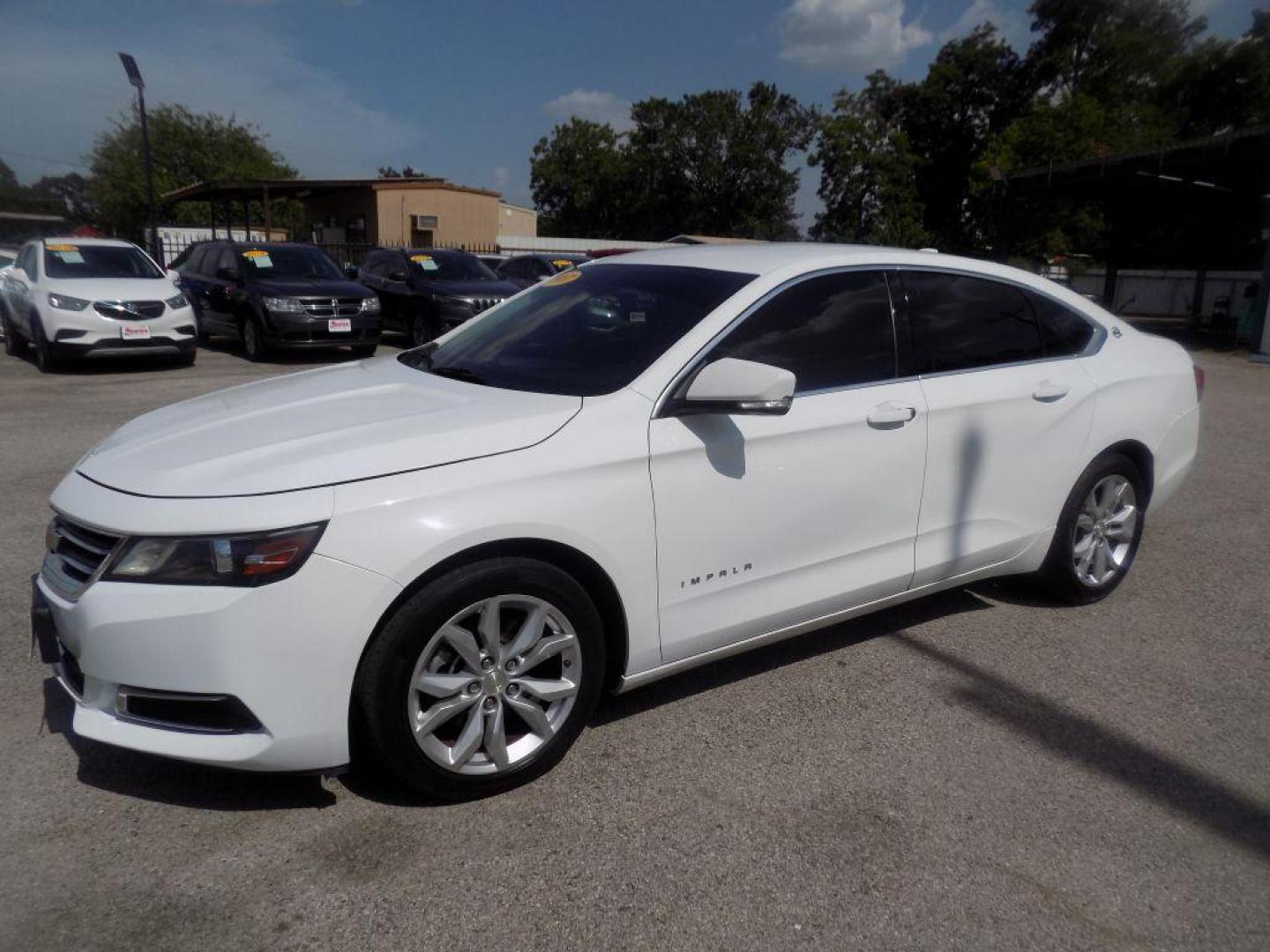 2017 WHITE CHEVROLET IMPALA LT (1G1105S39HU) with an 3.6L engine, Automatic transmission, located at 830 E. Canino Rd., Houston, TX, 77037, (281) 405-0440, 38.358219, -81.729942 - Photo#5