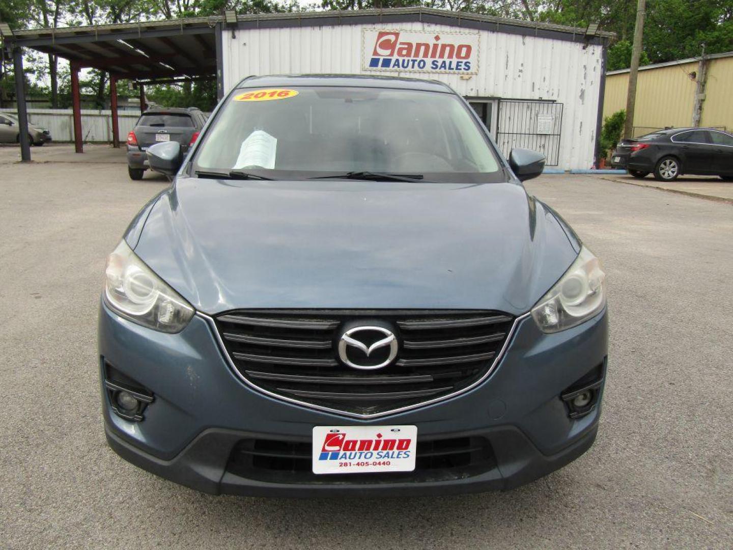 2016 BLUE MAZDA CX-5 TOURING (JM3KE2CY9G0) with an 2.5L engine, Automatic transmission, located at 830 E. Canino Rd., Houston, TX, 77037, (281) 405-0440, 38.358219, -81.729942 - Photo#0