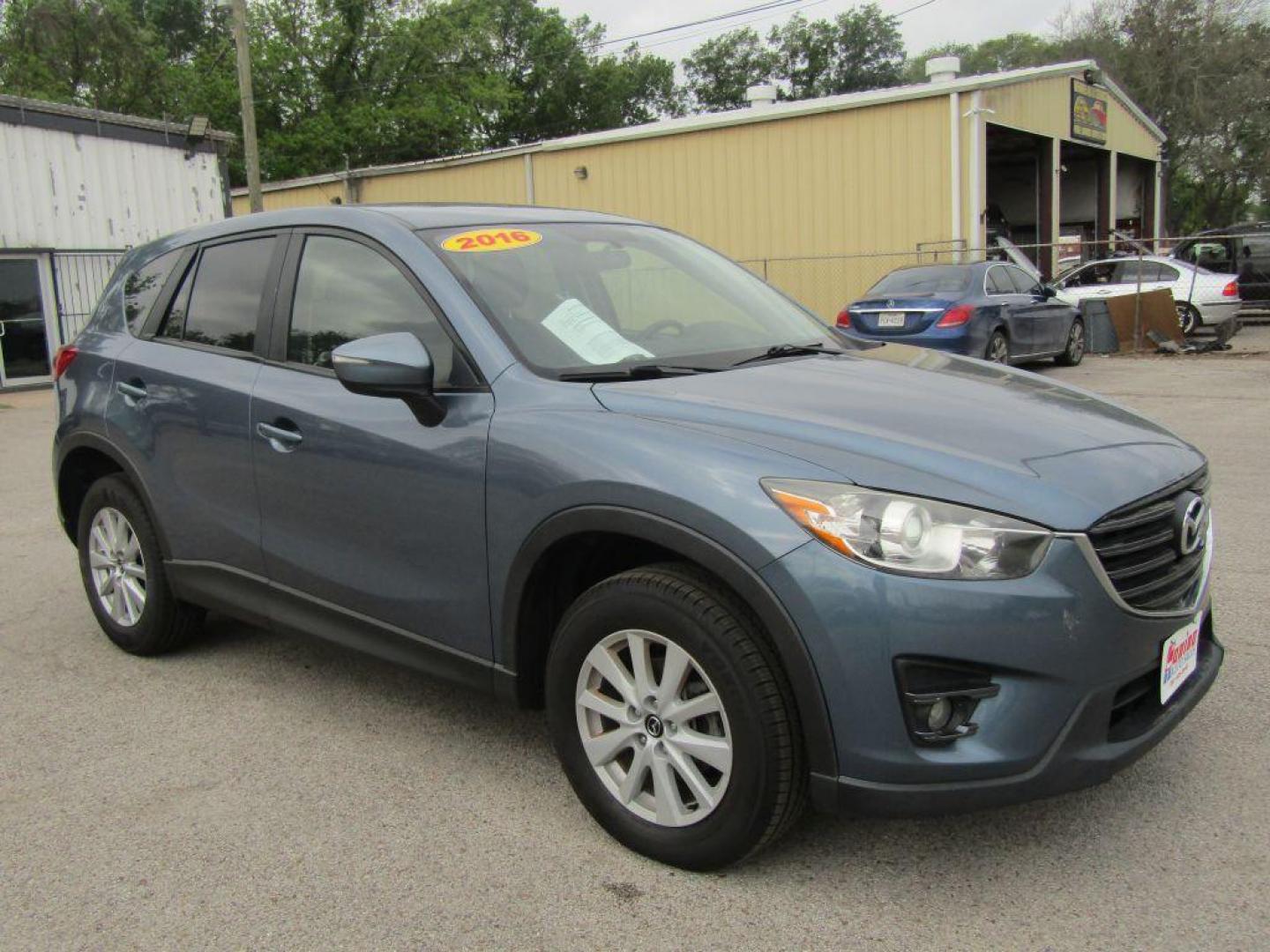 2016 BLUE MAZDA CX-5 TOURING (JM3KE2CY9G0) with an 2.5L engine, Automatic transmission, located at 830 E. Canino Rd., Houston, TX, 77037, (281) 405-0440, 38.358219, -81.729942 - Photo#1