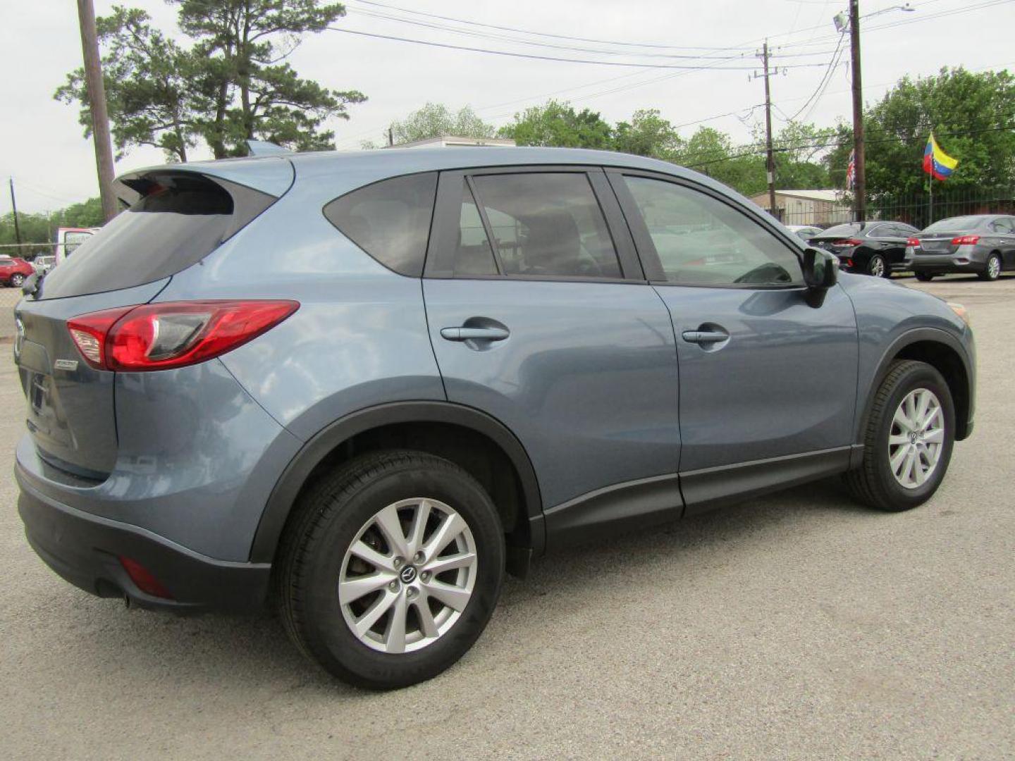 2016 BLUE MAZDA CX-5 TOURING (JM3KE2CY9G0) with an 2.5L engine, Automatic transmission, located at 830 E. Canino Rd., Houston, TX, 77037, (281) 405-0440, 38.358219, -81.729942 - Photo#2