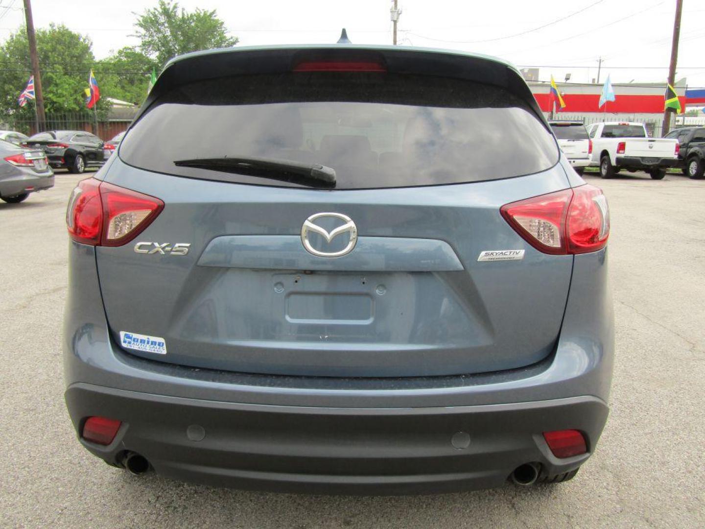 2016 BLUE MAZDA CX-5 TOURING (JM3KE2CY9G0) with an 2.5L engine, Automatic transmission, located at 830 E. Canino Rd., Houston, TX, 77037, (281) 405-0440, 38.358219, -81.729942 - Photo#3