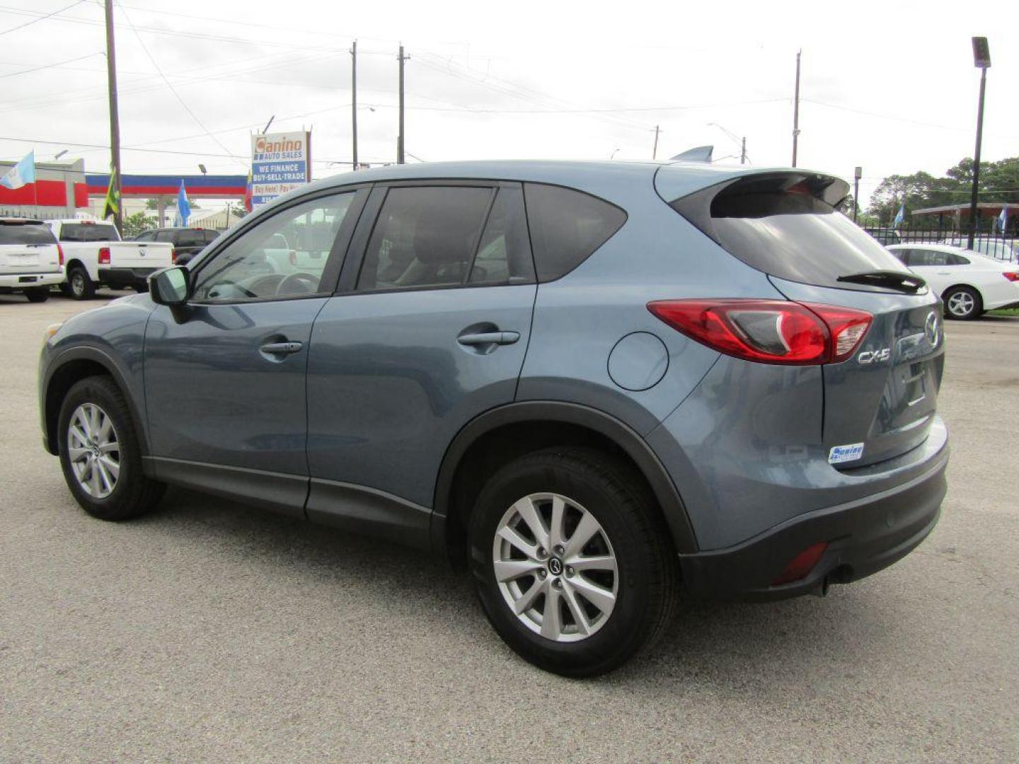 2016 BLUE MAZDA CX-5 TOURING (JM3KE2CY9G0) with an 2.5L engine, Automatic transmission, located at 830 E. Canino Rd., Houston, TX, 77037, (281) 405-0440, 38.358219, -81.729942 - Photo#4