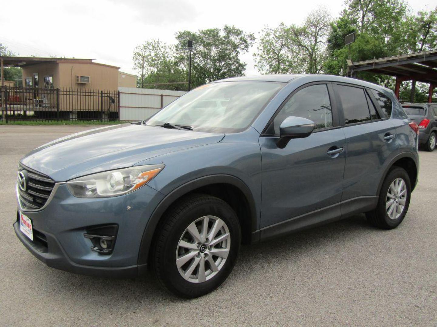 2016 BLUE MAZDA CX-5 TOURING (JM3KE2CY9G0) with an 2.5L engine, Automatic transmission, located at 830 E. Canino Rd., Houston, TX, 77037, (281) 405-0440, 38.358219, -81.729942 - Photo#5