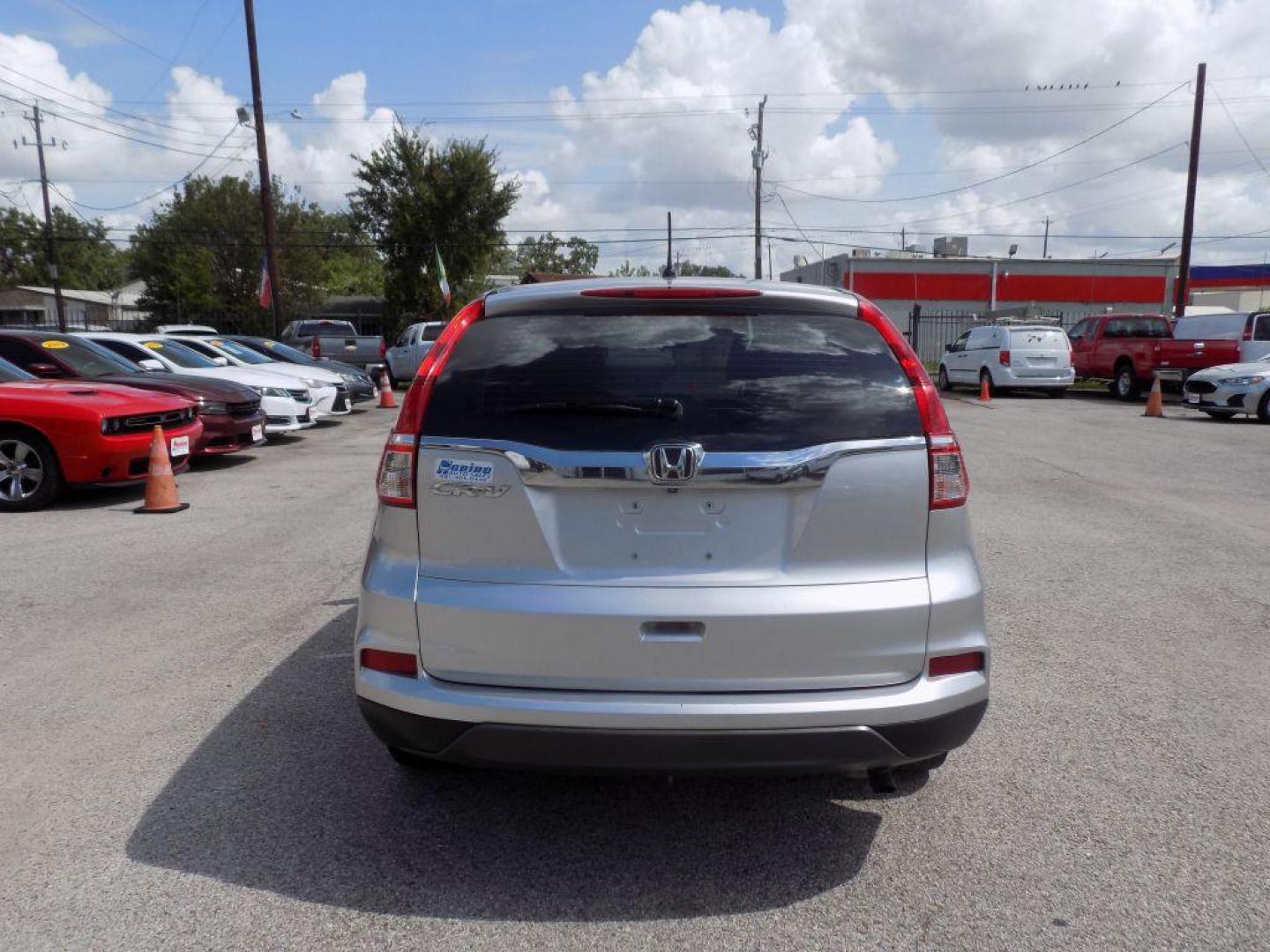 2016 SILVER HONDA CR-V LX (3CZRM3H38GG) with an 2.4L engine, Continuously Variable transmission, located at 830 E. Canino Rd., Houston, TX, 77037, (281) 405-0440, 38.358219, -81.729942 - Photo#2