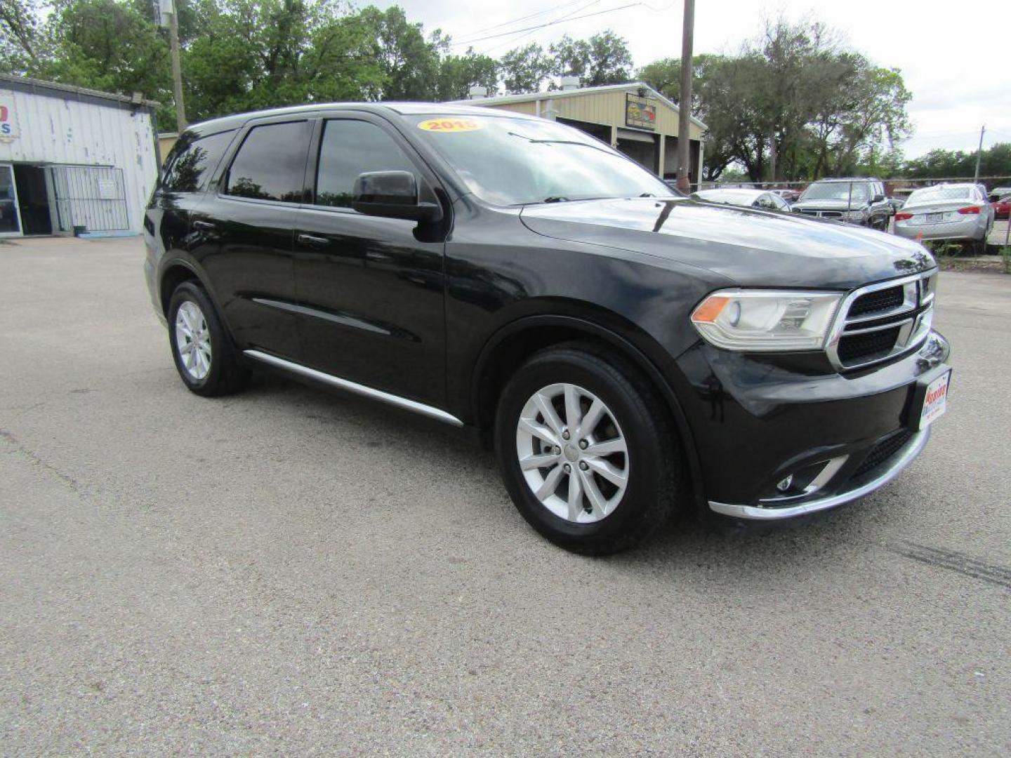 2015 BLACK DODGE DURANGO SXT (1C4RDHAG2FC) with an 3.6L engine, Automatic transmission, located at 830 E. Canino Rd., Houston, TX, 77037, (281) 405-0440, 38.358219, -81.729942 - Photo#5