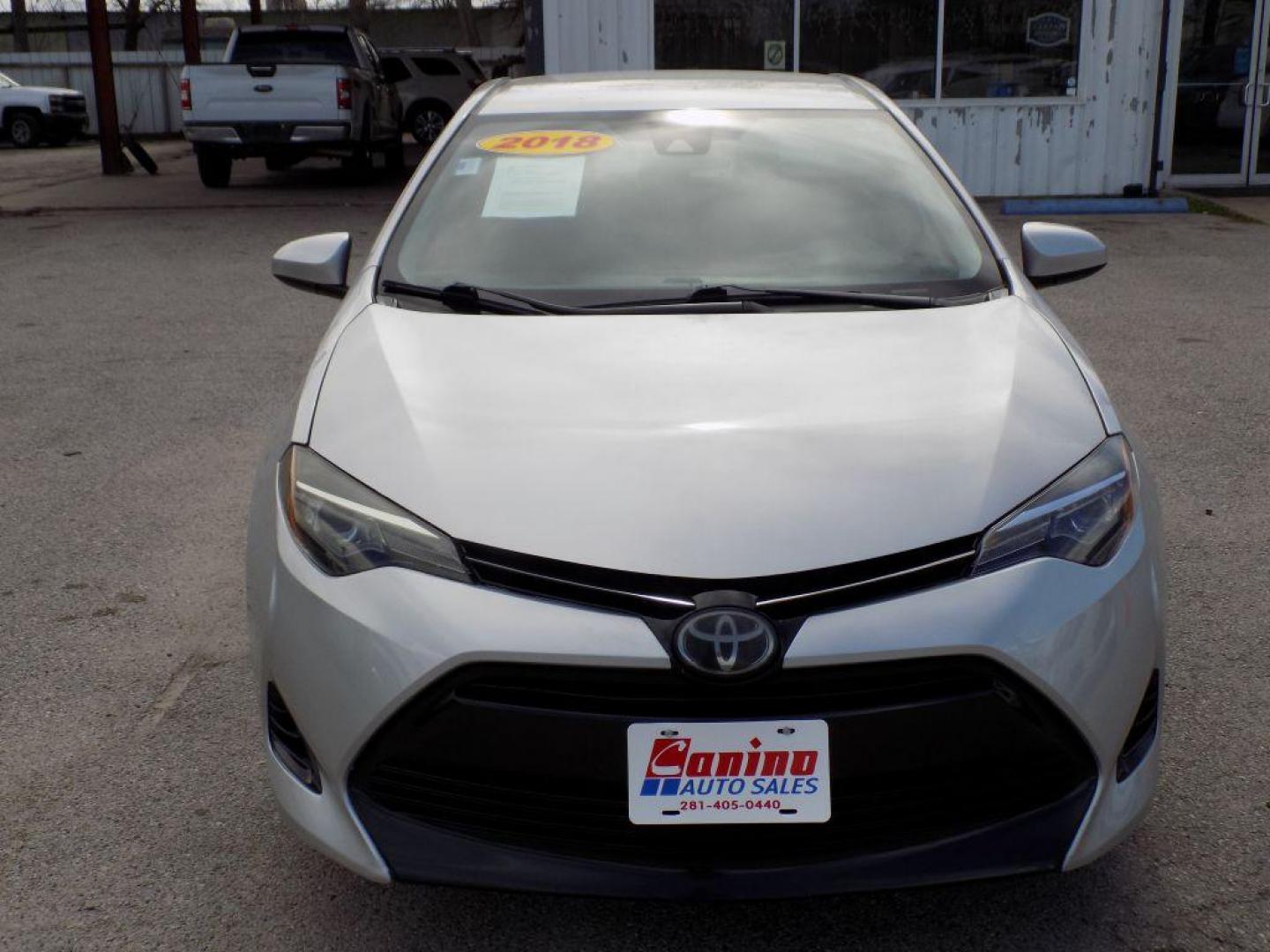 2018 SILVER TOYOTA COROLLA L (5YFBURHE8JP) with an 1.8L engine, Continuously Variable transmission, located at 830 E. Canino Rd., Houston, TX, 77037, (281) 405-0440, 38.358219, -81.729942 - PAGOS COMODOS, ENGANCHES COMODOS. FINANCIAMIENTO RAPIDO Y FACIL. BUEN CREDITO, MAL CREDITO, COMPRADOR POR PRIMERA VES O NO LICENCIA, CANINO AUTO SALES TE PUEDE AYUDAR! LLAMA/TEXTO O VISITANOS HOY MISMO (281) 405-0440 ESTAMOS LOCALIZADOS EN 830 E. CANINO RD. (ESQUINA CON AIRLINE) HOUSTON, TEXAS - Photo#0