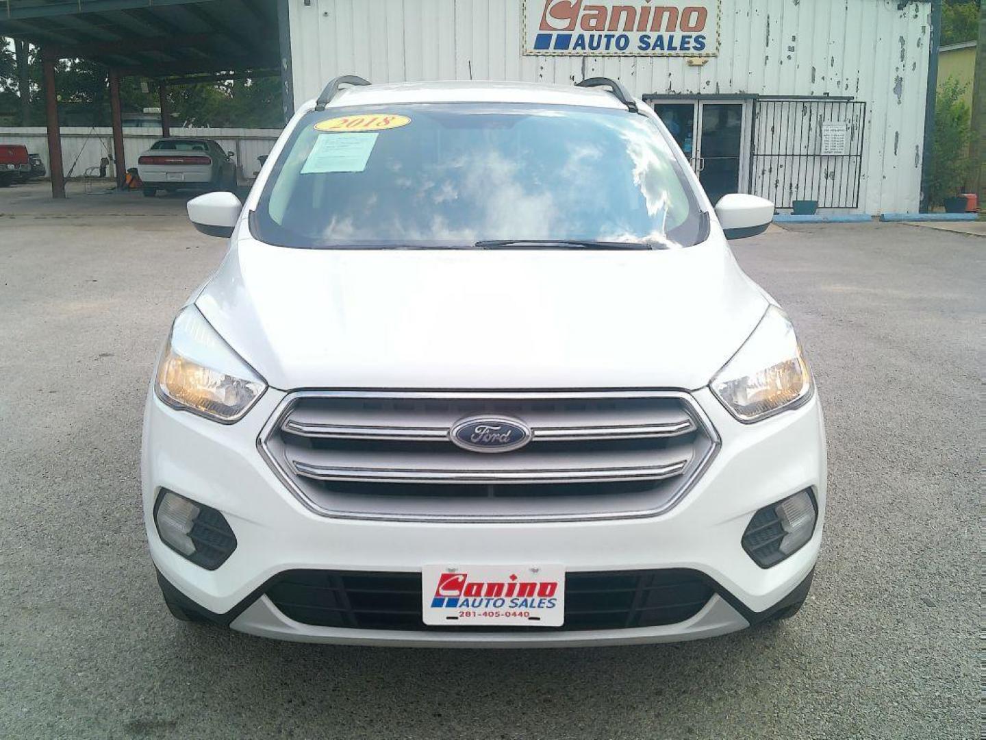 2018 WHITE FORD ESCAPE SE (1FMCU0GD9JU) with an 1.5L engine, Automatic transmission, located at 830 E. Canino Rd., Houston, TX, 77037, (281) 405-0440, 38.358219, -81.729942 - Photo#0