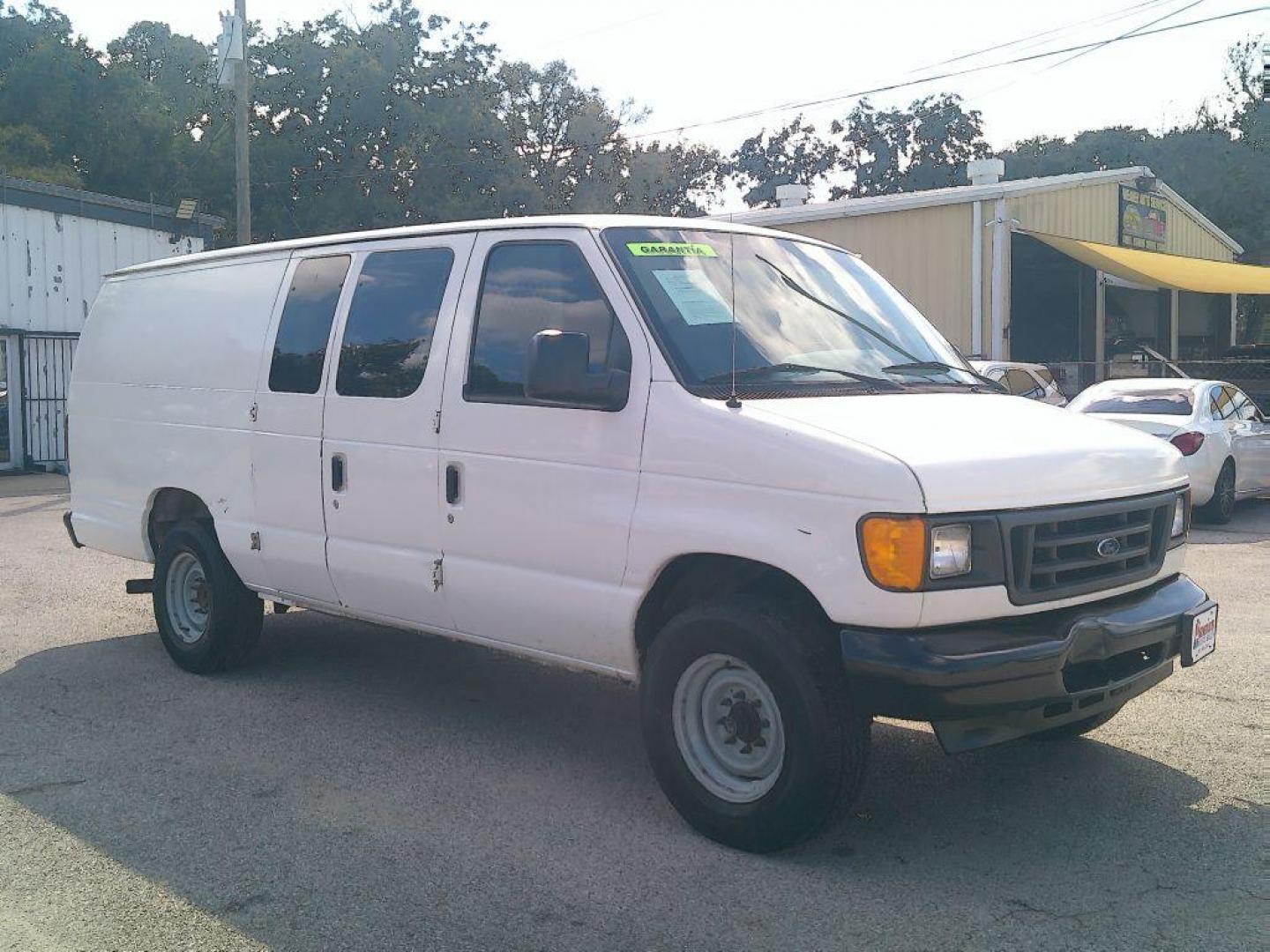 2005 WHITE FORD ECONOLINE E250 VAN (1FTNS24L35H) with an 5.4L engine, Automatic transmission, located at 830 E. Canino Rd., Houston, TX, 77037, (281) 405-0440, 38.358219, -81.729942 - VENGA A VISITARNOS A CANINO AUTO SALES. ENTRE CAMINANDO Y SALGA MANEJANDO. APROVACION GARANTIZADA CON REQUISITOS MINIMOS! PREGUNTEN POR JESSICA, MAY, O CARRIE PARA SU APROBACION SEGURA. ??830 E CANINO RD HOUSTON TX 77037 ??(281) 405-0440 come visit us today!! walk in/ drive out in minutes! - Photo#1