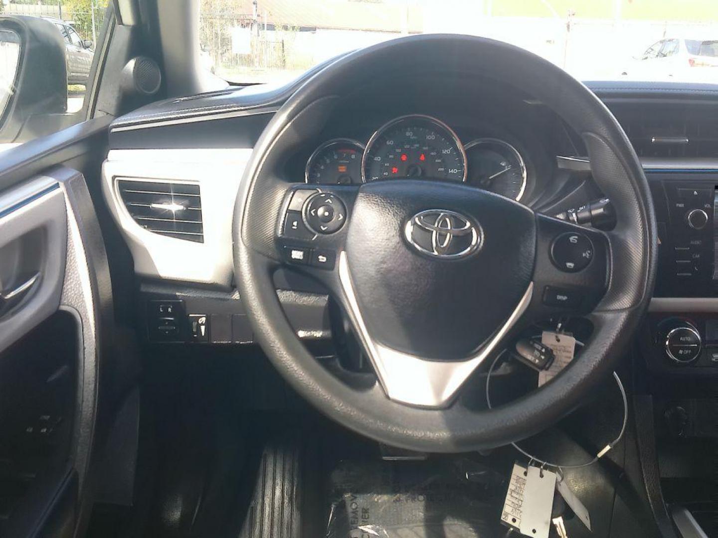 2015 WHITE TOYOTA COROLLA L (5YFBURHE7FP) with an 1.8L engine, Automatic transmission, located at 830 E. Canino Rd., Houston, TX, 77037, (281) 405-0440, 38.358219, -81.729942 - Photo#18