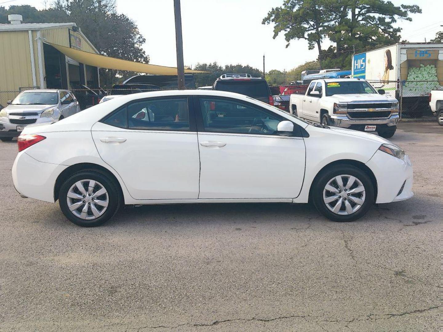 2015 WHITE TOYOTA COROLLA L (5YFBURHE7FP) with an 1.8L engine, Automatic transmission, located at 830 E. Canino Rd., Houston, TX, 77037, (281) 405-0440, 38.358219, -81.729942 - Photo#2