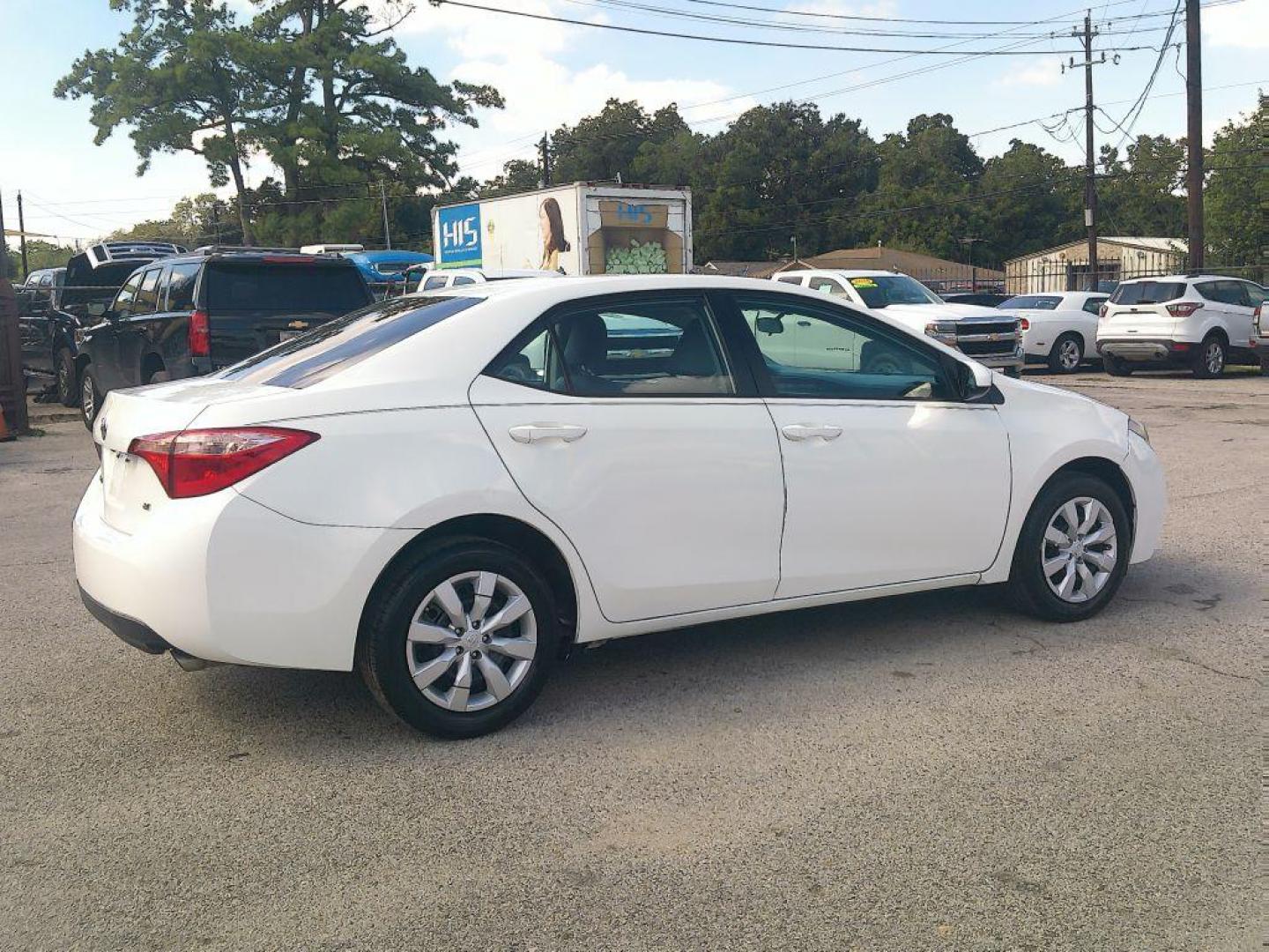 2015 WHITE TOYOTA COROLLA L (5YFBURHE7FP) with an 1.8L engine, Automatic transmission, located at 830 E. Canino Rd., Houston, TX, 77037, (281) 405-0440, 38.358219, -81.729942 - Photo#3