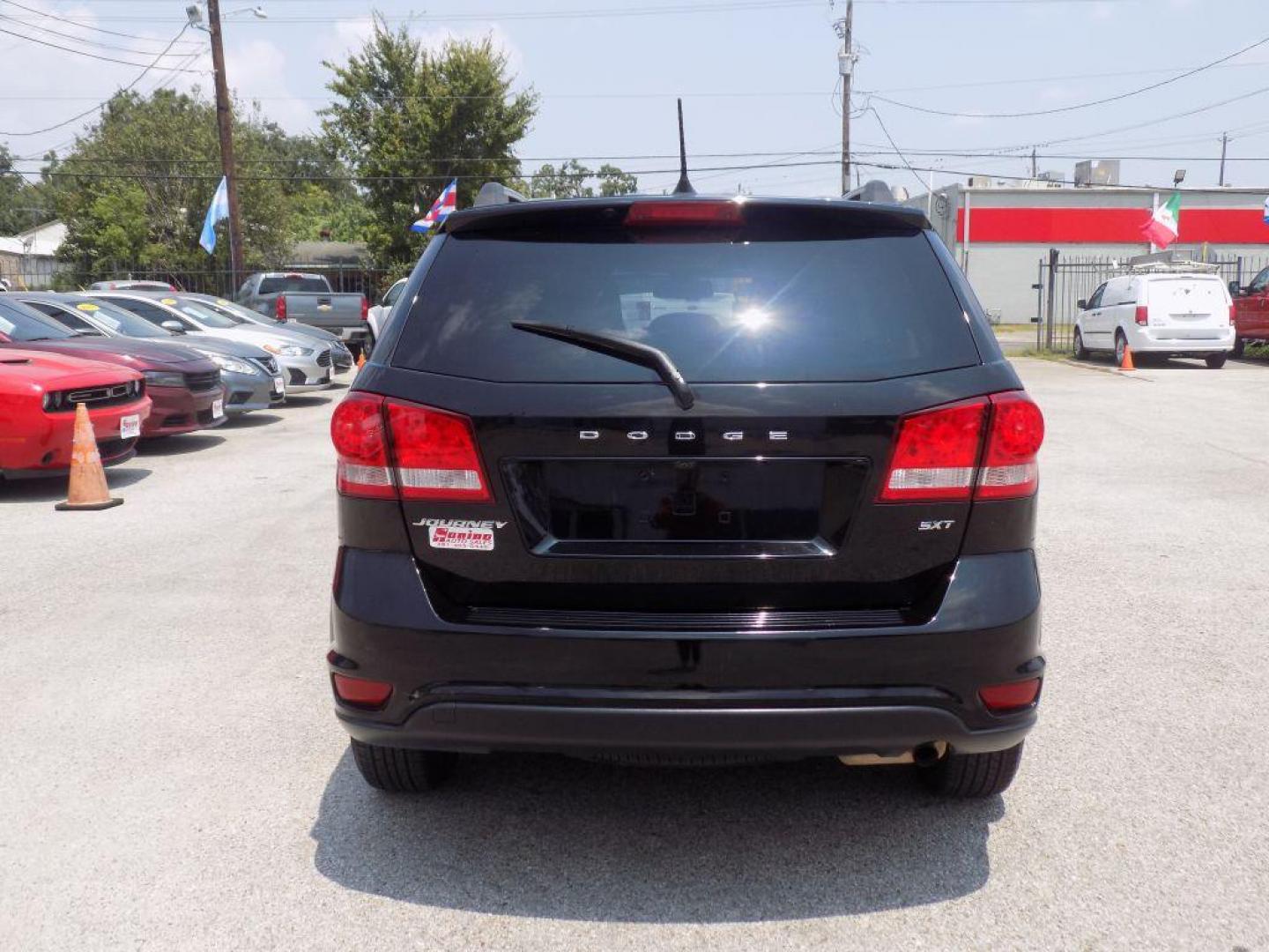 2018 BLACK DODGE JOURNEY SXT (3C4PDCBB8JT) with an 2.4L engine, Automatic transmission, located at 830 E. Canino Rd., Houston, TX, 77037, (281) 405-0440, 38.358219, -81.729942 - Photo#2