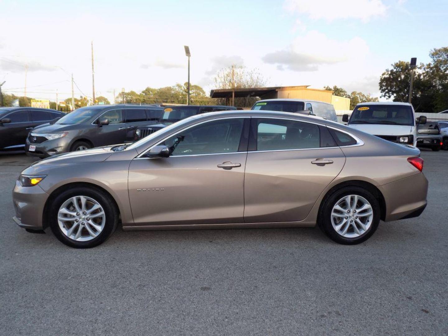 2018 GOLD CHEVROLET MALIBU LT (1G1ZD5ST3JF) with an 1.5L engine, Automatic transmission, located at 830 E. Canino Rd., Houston, TX, 77037, (281) 405-0440, 38.358219, -81.729942 - Photo#6