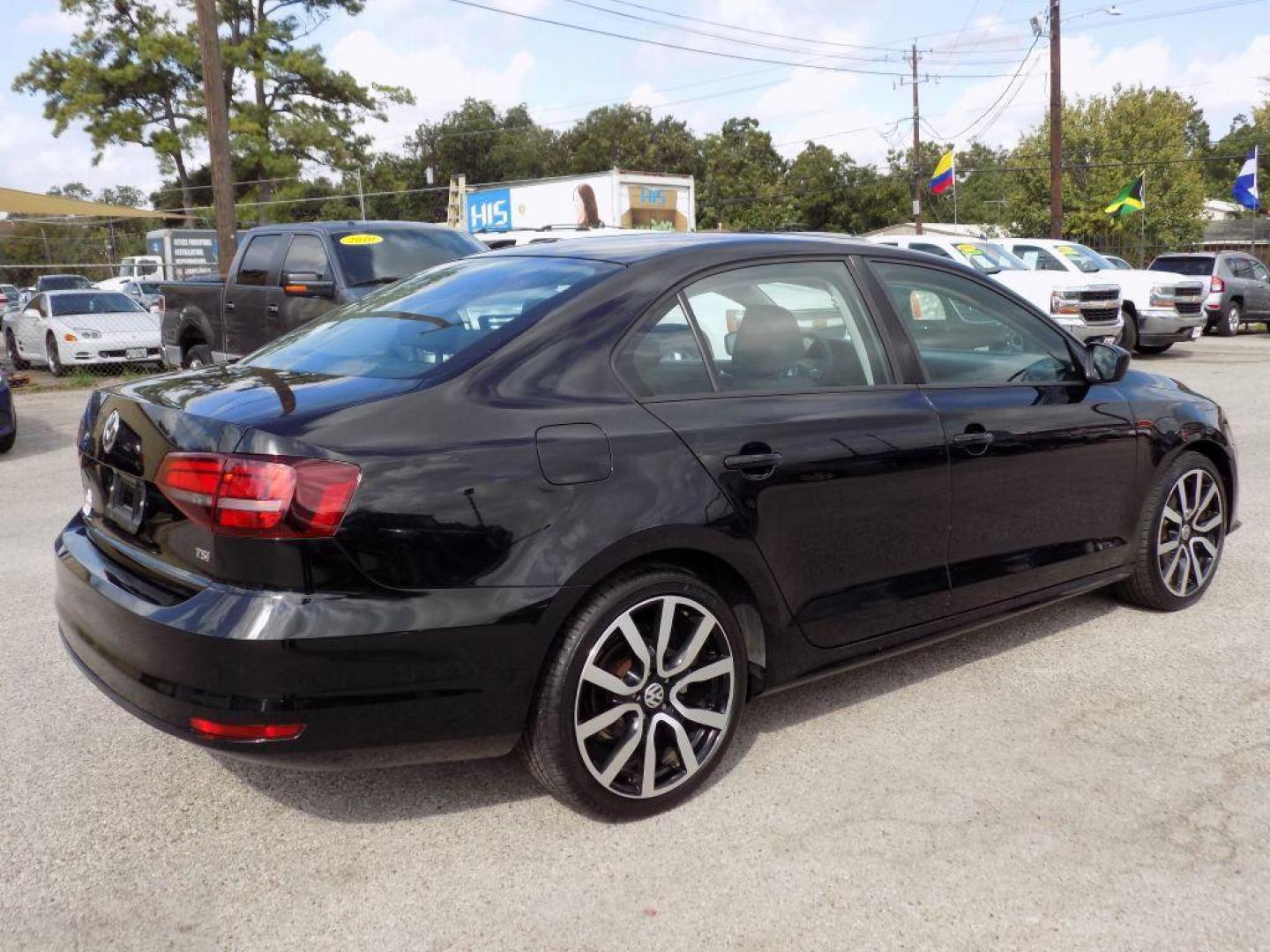 2016 BLACK VOLKSWAGEN JETTA S (3VW267AJ7GM) with an 1.4L engine, Automatic transmission, located at 830 E. Canino Rd., Houston, TX, 77037, (281) 405-0440, 38.358219, -81.729942 - Photo#2