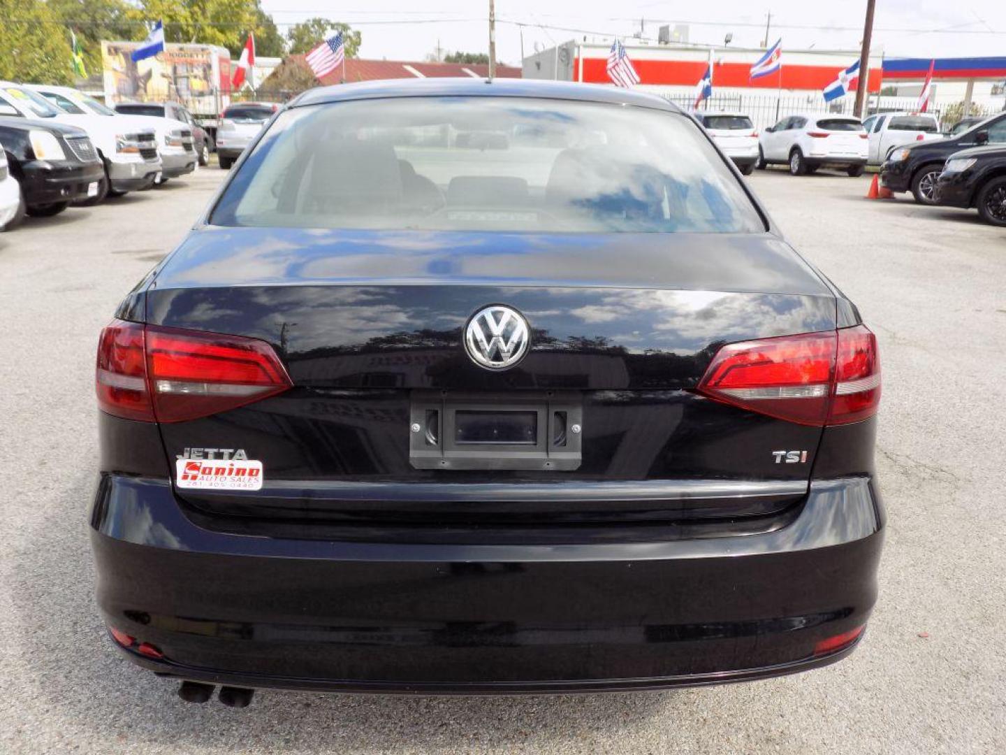 2016 BLACK VOLKSWAGEN JETTA S (3VW267AJ7GM) with an 1.4L engine, Automatic transmission, located at 830 E. Canino Rd., Houston, TX, 77037, (281) 405-0440, 38.358219, -81.729942 - Photo#3