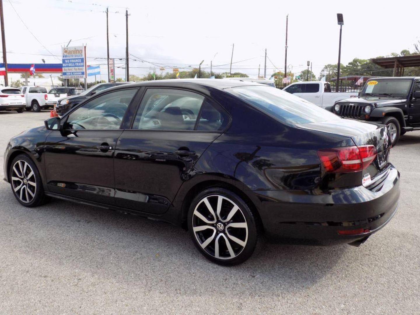 2016 BLACK VOLKSWAGEN JETTA S (3VW267AJ7GM) with an 1.4L engine, Automatic transmission, located at 830 E. Canino Rd., Houston, TX, 77037, (281) 405-0440, 38.358219, -81.729942 - Photo#6