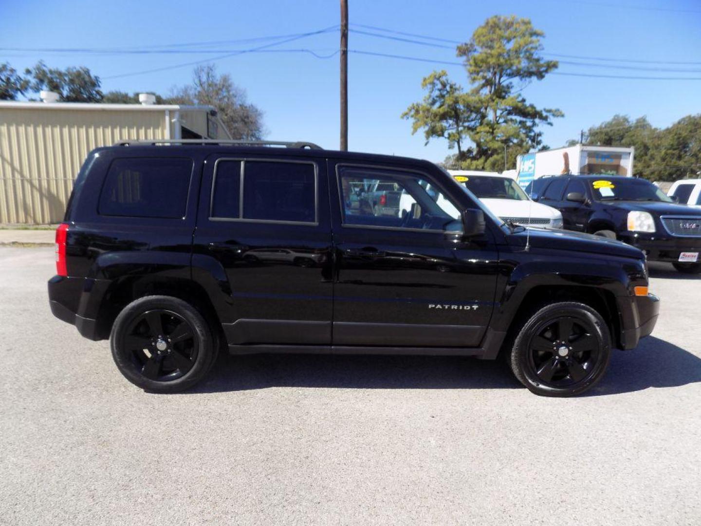 2015 BLACK JEEP PATRIOT LATITUDE (1C4NJPFAXFD) with an 2.0L engine, Continuously Variable transmission, located at 830 E. Canino Rd., Houston, TX, 77037, (281) 405-0440, 38.358219, -81.729942 - Photo#2