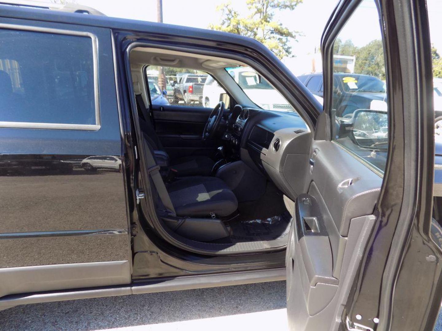 2015 BLACK JEEP PATRIOT LATITUDE (1C4NJPFAXFD) with an 2.0L engine, Continuously Variable transmission, located at 830 E. Canino Rd., Houston, TX, 77037, (281) 405-0440, 38.358219, -81.729942 - Photo#32