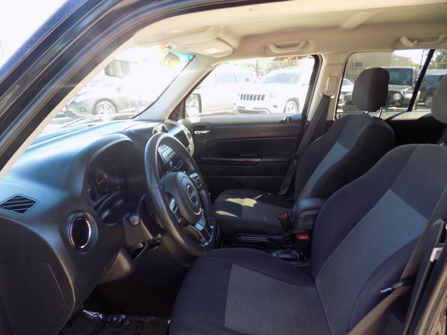 2015 BLACK JEEP PATRIOT LATITUDE (1C4NJPFAXFD) with an 2.0L engine, Continuously Variable transmission, located at 830 E. Canino Rd., Houston, TX, 77037, (281) 405-0440, 38.358219, -81.729942 - Photo#33