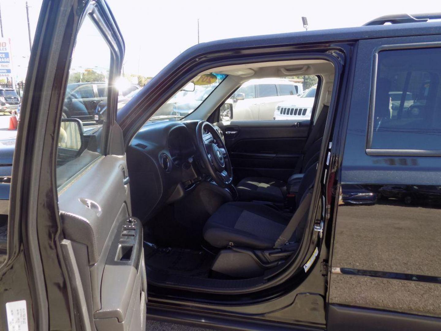 2015 BLACK JEEP PATRIOT LATITUDE (1C4NJPFAXFD) with an 2.0L engine, Continuously Variable transmission, located at 830 E. Canino Rd., Houston, TX, 77037, (281) 405-0440, 38.358219, -81.729942 - Photo#34