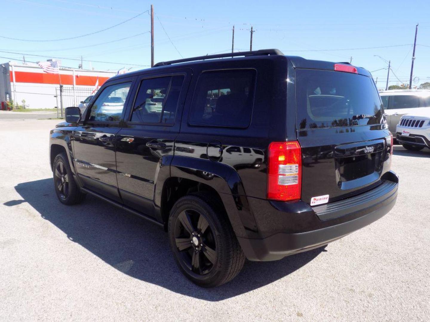 2015 BLACK JEEP PATRIOT LATITUDE (1C4NJPFAXFD) with an 2.0L engine, Continuously Variable transmission, located at 830 E. Canino Rd., Houston, TX, 77037, (281) 405-0440, 38.358219, -81.729942 - Photo#5