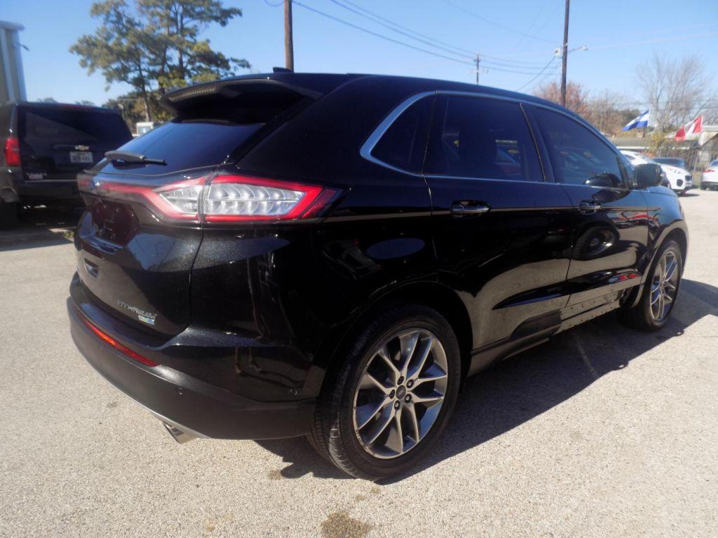 2015 BLACK FORD EDGE TITANIUM (2FMPK4K90FB) with an 2.0L engine, Automatic transmission, located at 830 E. Canino Rd., Houston, TX, 77037, (281) 405-0440, 38.358219, -81.729942 - Photo#2