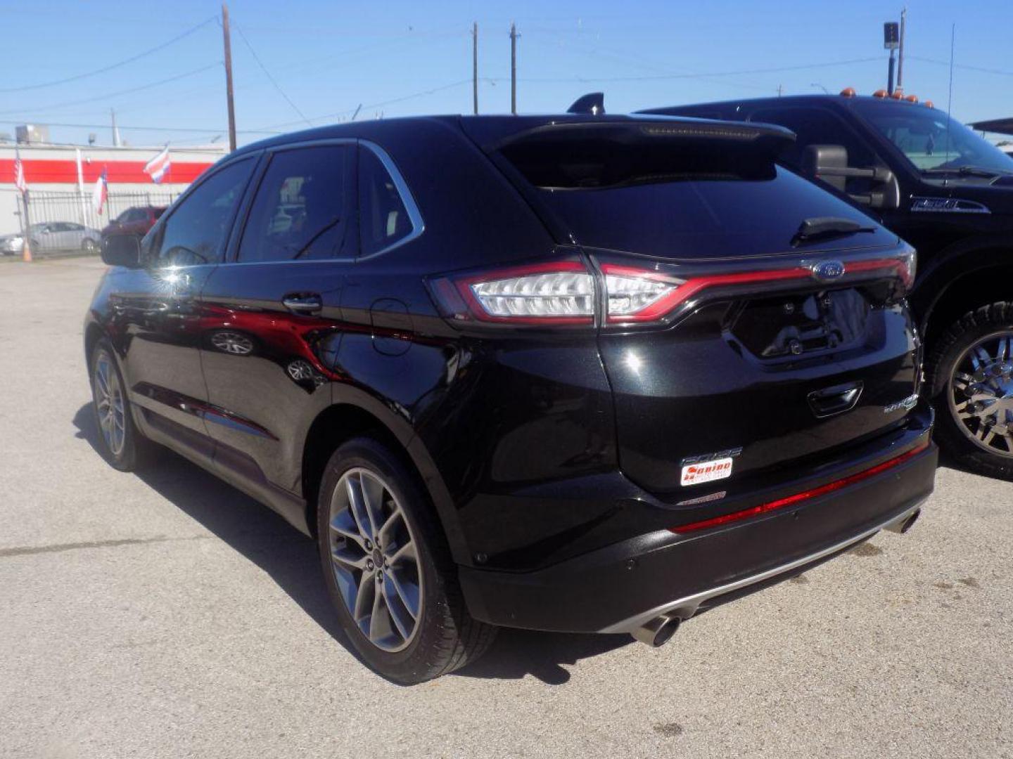 2015 BLACK FORD EDGE TITANIUM (2FMPK4K90FB) with an 2.0L engine, Automatic transmission, located at 830 E. Canino Rd., Houston, TX, 77037, (281) 405-0440, 38.358219, -81.729942 - Photo#4