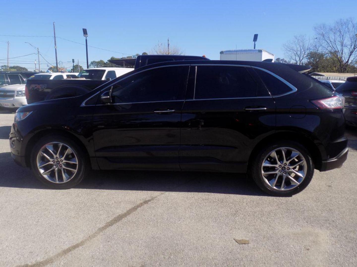 2015 BLACK FORD EDGE TITANIUM (2FMPK4K90FB) with an 2.0L engine, Automatic transmission, located at 830 E. Canino Rd., Houston, TX, 77037, (281) 405-0440, 38.358219, -81.729942 - Photo#5