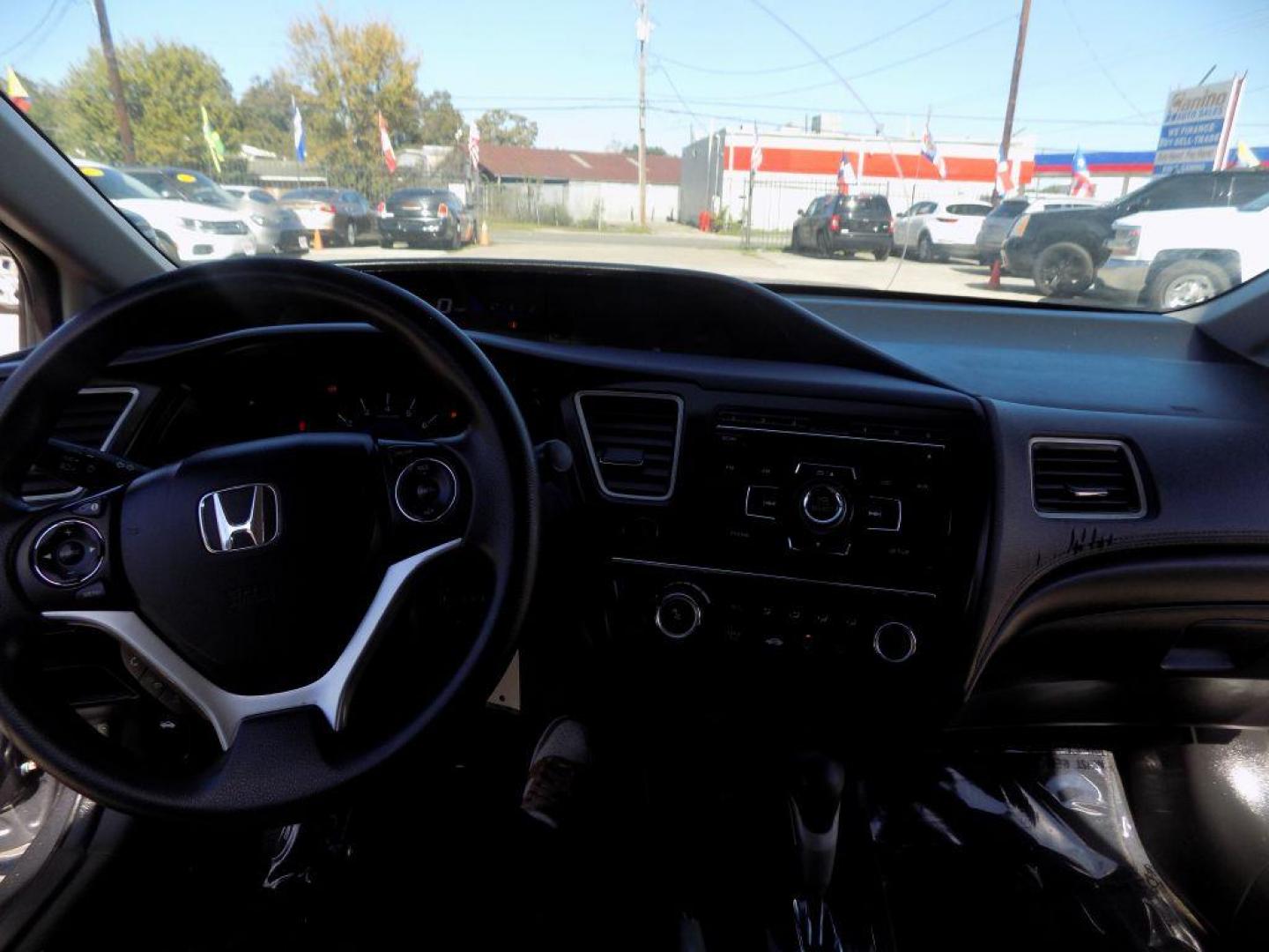 2015 GRAY HONDA CIVIC LX (19XFB2F56FE) with an 1.8L engine, Continuously Variable transmission, located at 830 E. Canino Rd., Houston, TX, 77037, (281) 405-0440, 38.358219, -81.729942 - VENGA A VISITARNOS A CANINO AUTO SALES. ENTRE CAMINANDO Y SALGA MANEJANDO. APROVACION GARANTIZADA CON REQUISITOS MINIMOS! PREGUNTEN POR JESSICA, MAY, O CARRIE PARA SU APROBACION SEGURA. ??830 E CANINO RD HOUSTON TX 77037 ??(281) 405-0440 come visit us today!! walk in/ drive out in minutes! - Photo#9