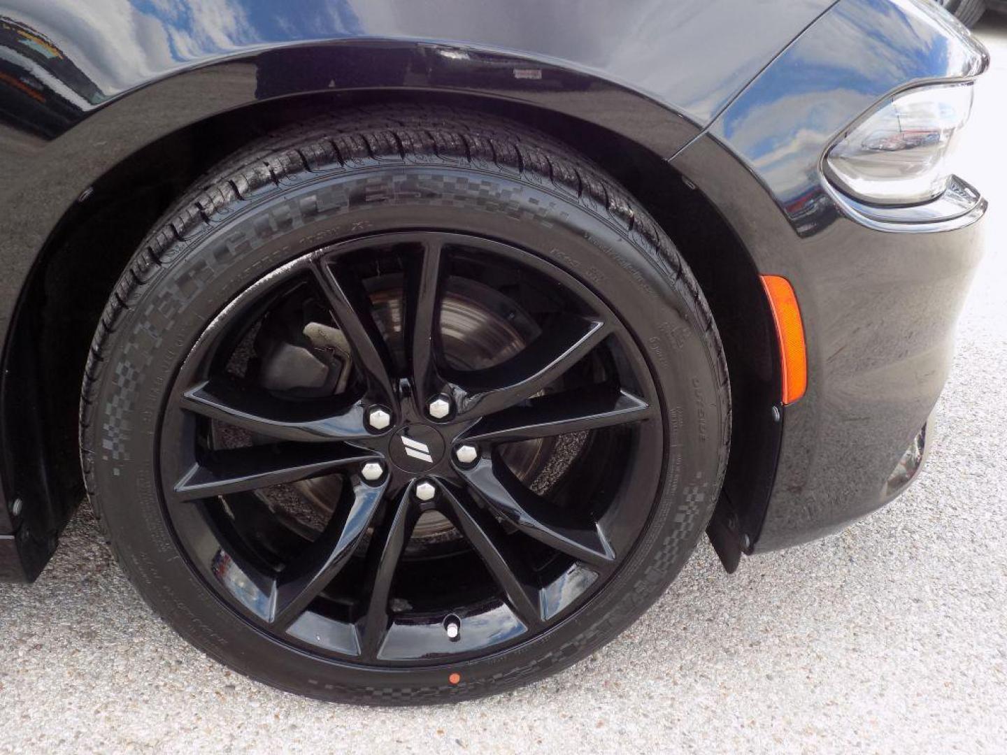 2018 BLACK DODGE CHARGER SXT (2C3CDXBG1JH) with an 3.6L engine, Automatic transmission, located at 830 E. Canino Rd., Houston, TX, 77037, (281) 405-0440, 38.358219, -81.729942 - Photo#9