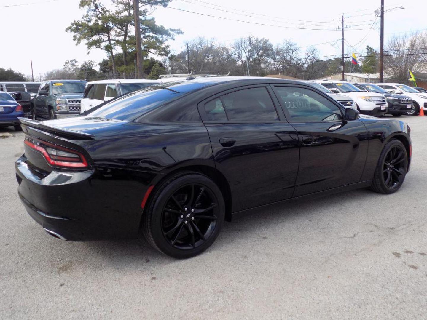 2018 BLACK DODGE CHARGER SXT (2C3CDXBG1JH) with an 3.6L engine, Automatic transmission, located at 830 E. Canino Rd., Houston, TX, 77037, (281) 405-0440, 38.358219, -81.729942 - Photo#2