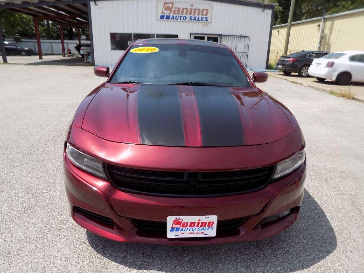 2019 MAROON DODGE CHARGER SXT (2C3CDXJGXKH) with an 3.6L engine, Automatic transmission, located at 830 E. Canino Rd., Houston, TX, 77037, (281) 405-0440, 38.358219, -81.729942 - Photo#0