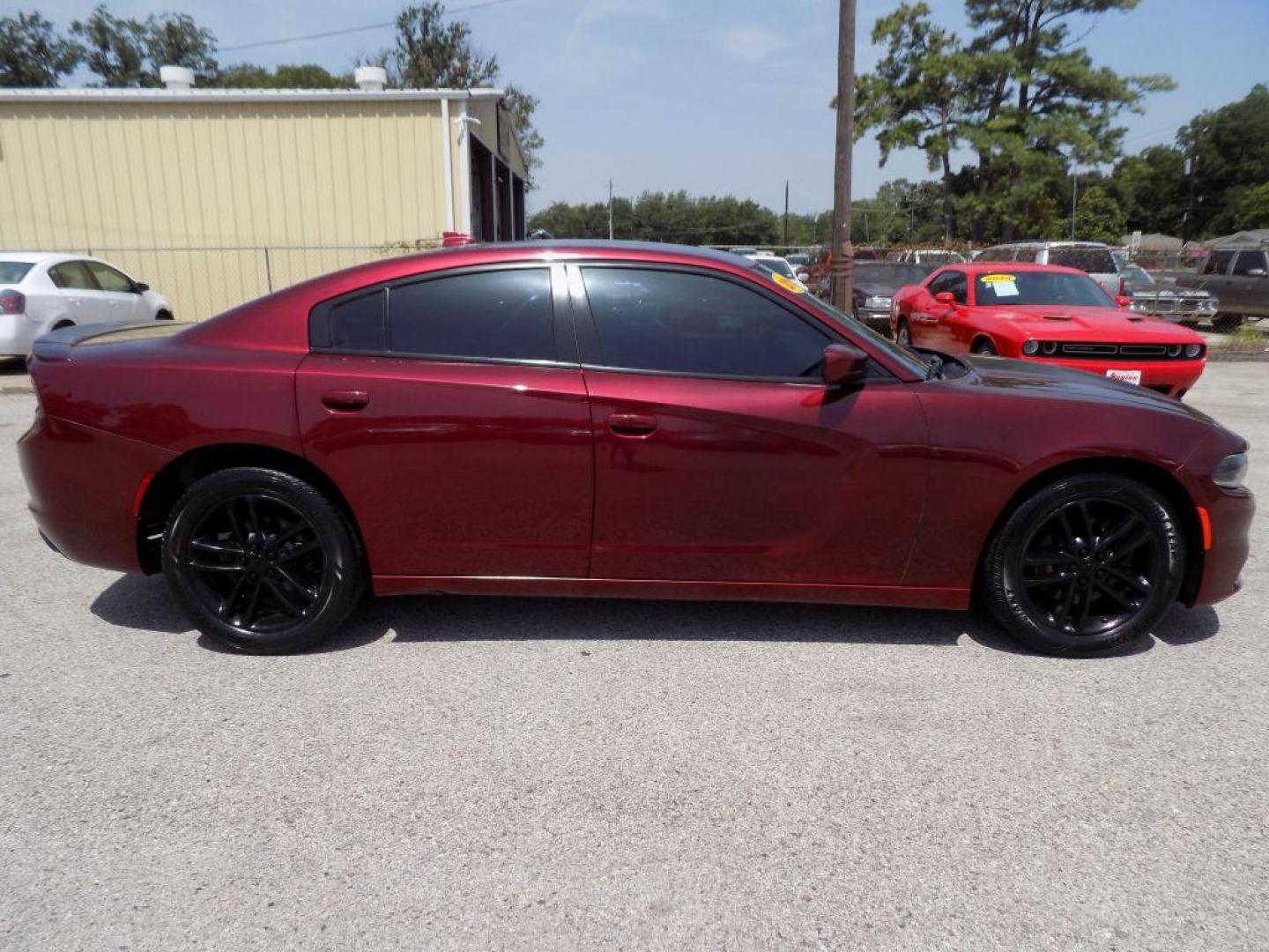 2019 MAROON DODGE CHARGER SXT (2C3CDXJGXKH) with an 3.6L engine, Automatic transmission, located at 830 E. Canino Rd., Houston, TX, 77037, (281) 405-0440, 38.358219, -81.729942 - Photo#1