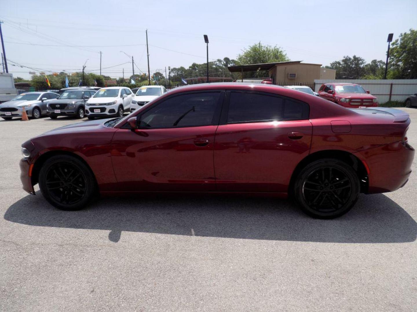 2019 MAROON DODGE CHARGER SXT (2C3CDXJGXKH) with an 3.6L engine, Automatic transmission, located at 830 E. Canino Rd., Houston, TX, 77037, (281) 405-0440, 38.358219, -81.729942 - Photo#3