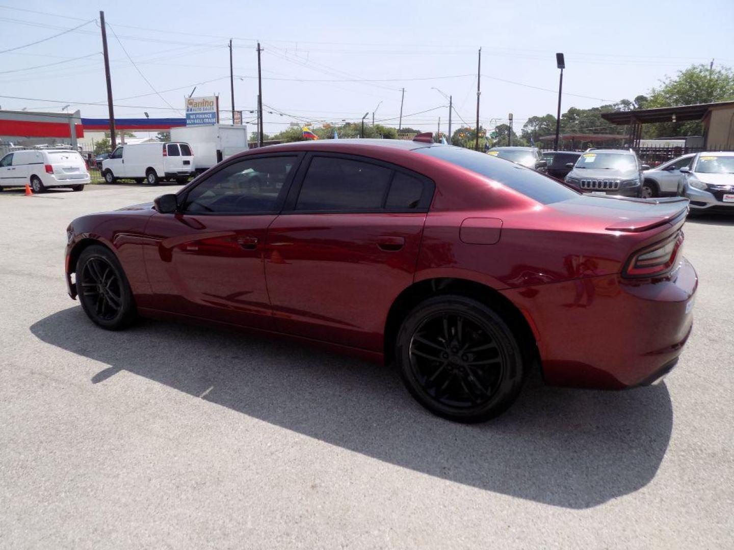 2019 MAROON DODGE CHARGER SXT (2C3CDXJGXKH) with an 3.6L engine, Automatic transmission, located at 830 E. Canino Rd., Houston, TX, 77037, (281) 405-0440, 38.358219, -81.729942 - Photo#4