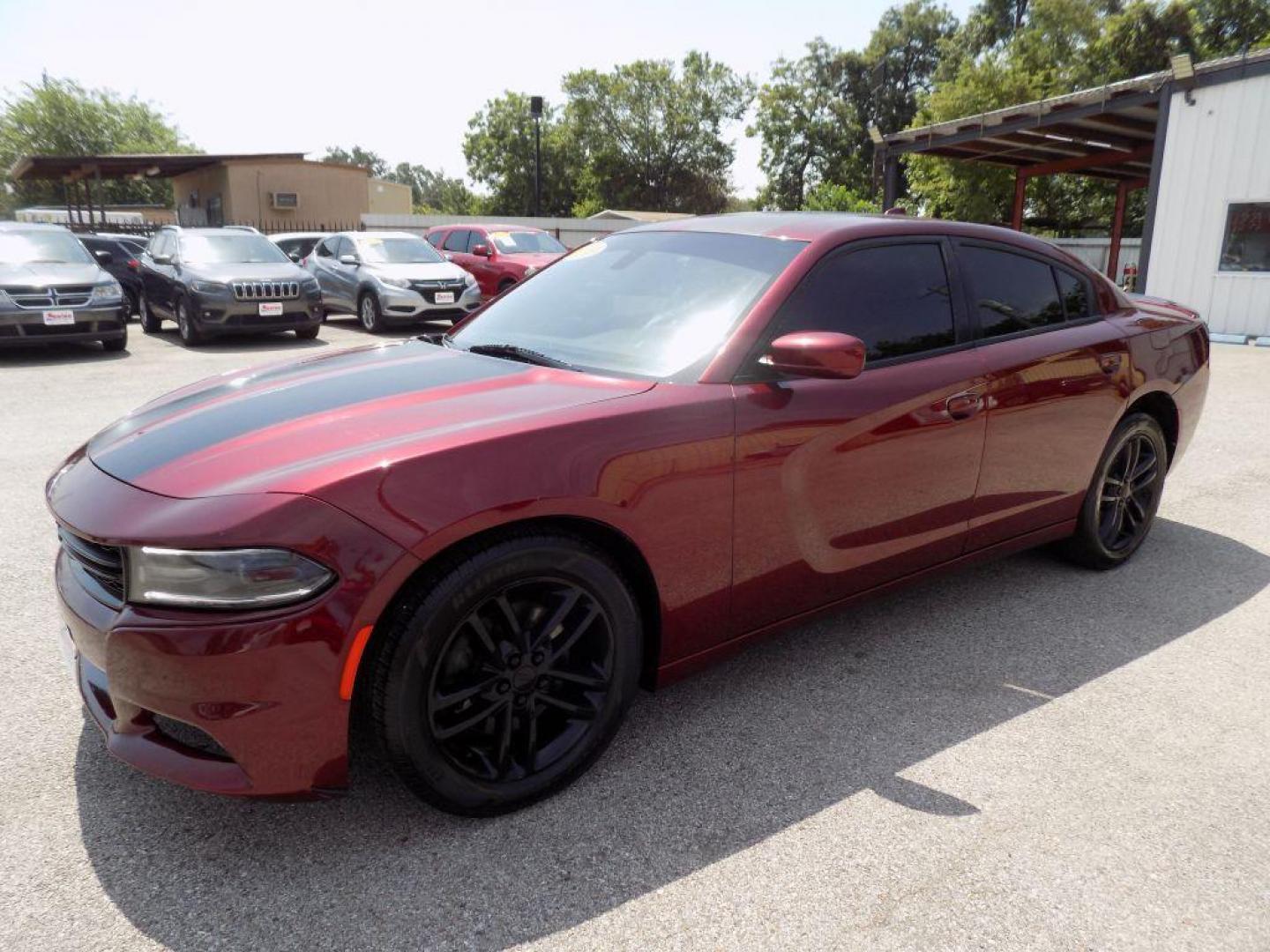 2019 MAROON DODGE CHARGER SXT (2C3CDXJGXKH) with an 3.6L engine, Automatic transmission, located at 830 E. Canino Rd., Houston, TX, 77037, (281) 405-0440, 38.358219, -81.729942 - Photo#5