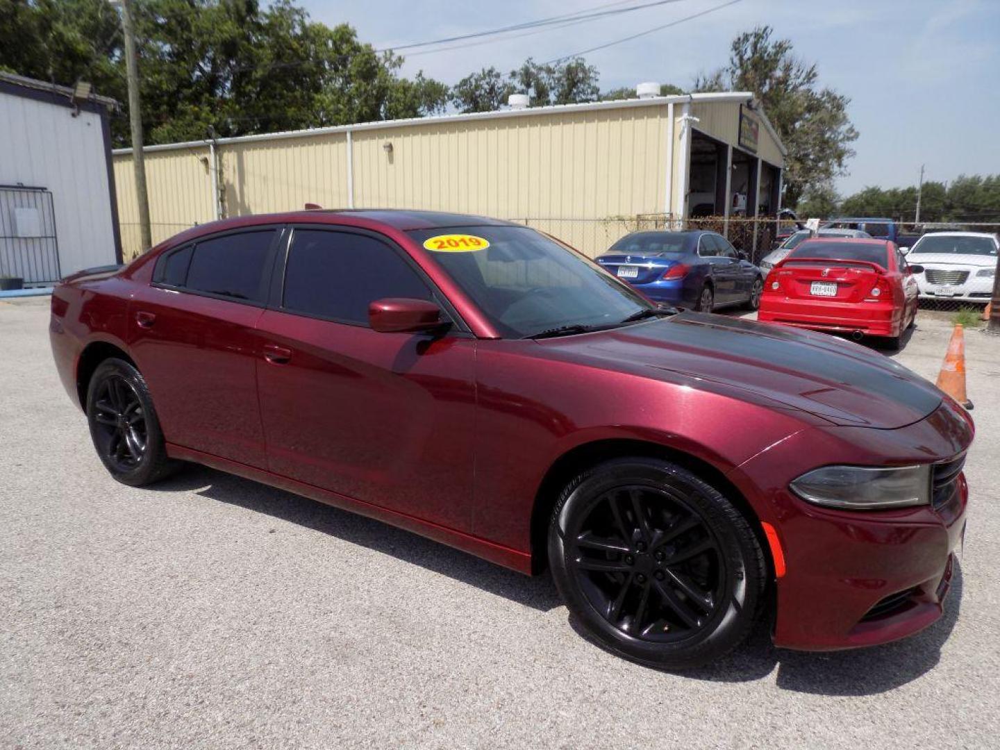 2019 MAROON DODGE CHARGER SXT (2C3CDXJGXKH) with an 3.6L engine, Automatic transmission, located at 830 E. Canino Rd., Houston, TX, 77037, (281) 405-0440, 38.358219, -81.729942 - Photo#6