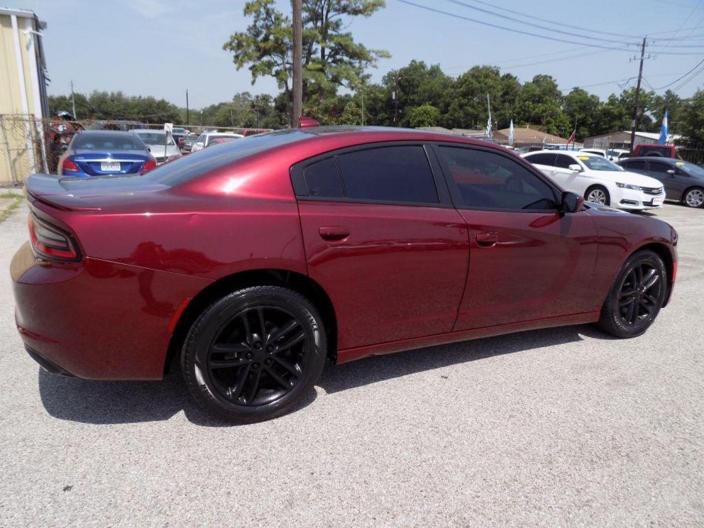 2019 MAROON DODGE CHARGER SXT (2C3CDXJGXKH) with an 3.6L engine, Automatic transmission, located at 830 E. Canino Rd., Houston, TX, 77037, (281) 405-0440, 38.358219, -81.729942 - Photo#7