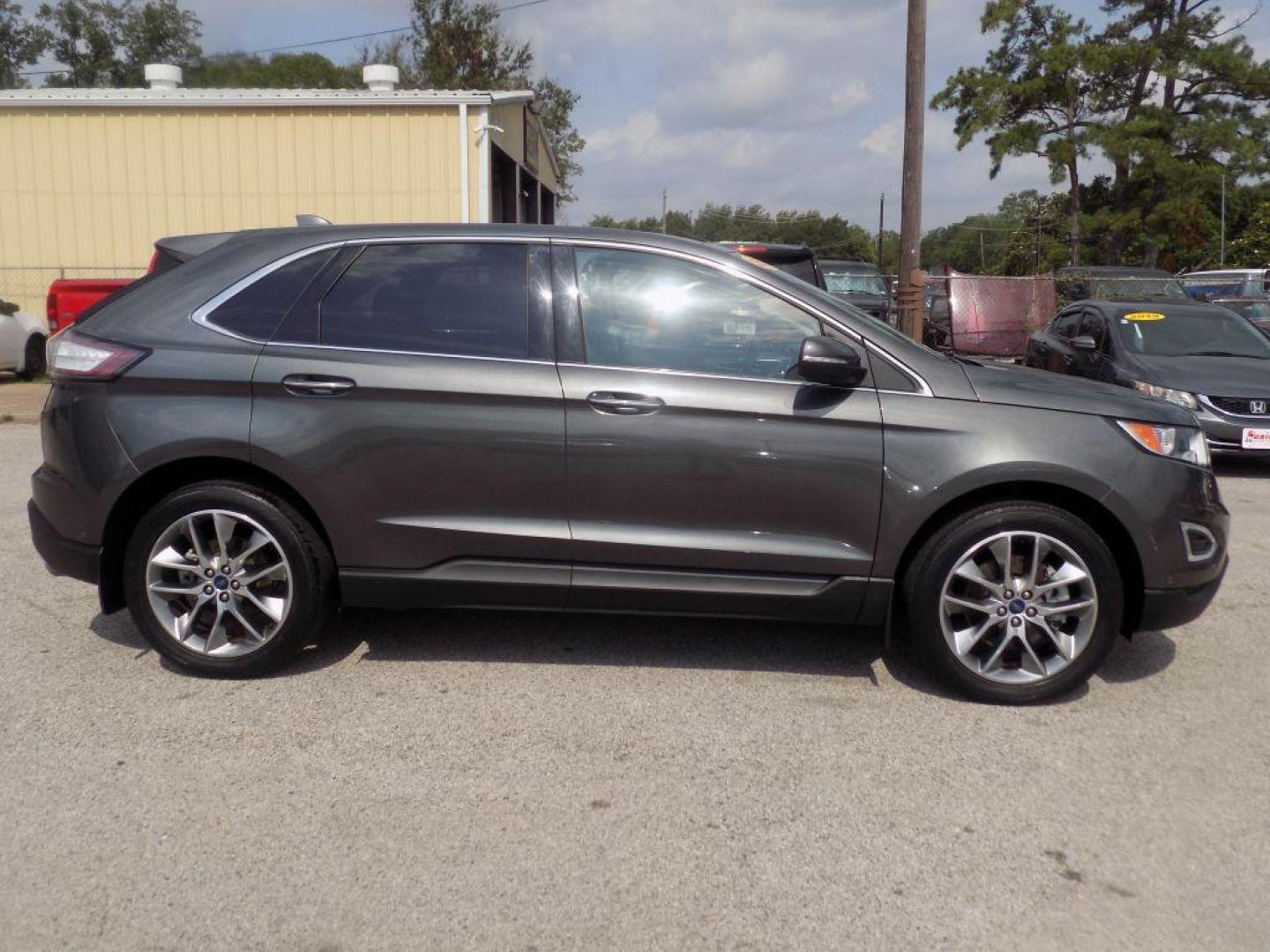 2015 GRAY FORD EDGE TITANIUM (2FMPK4K95FB) with an 2.0L engine, Automatic transmission, located at 830 E. Canino Rd., Houston, TX, 77037, (281) 405-0440, 38.358219, -81.729942 - Photo#1